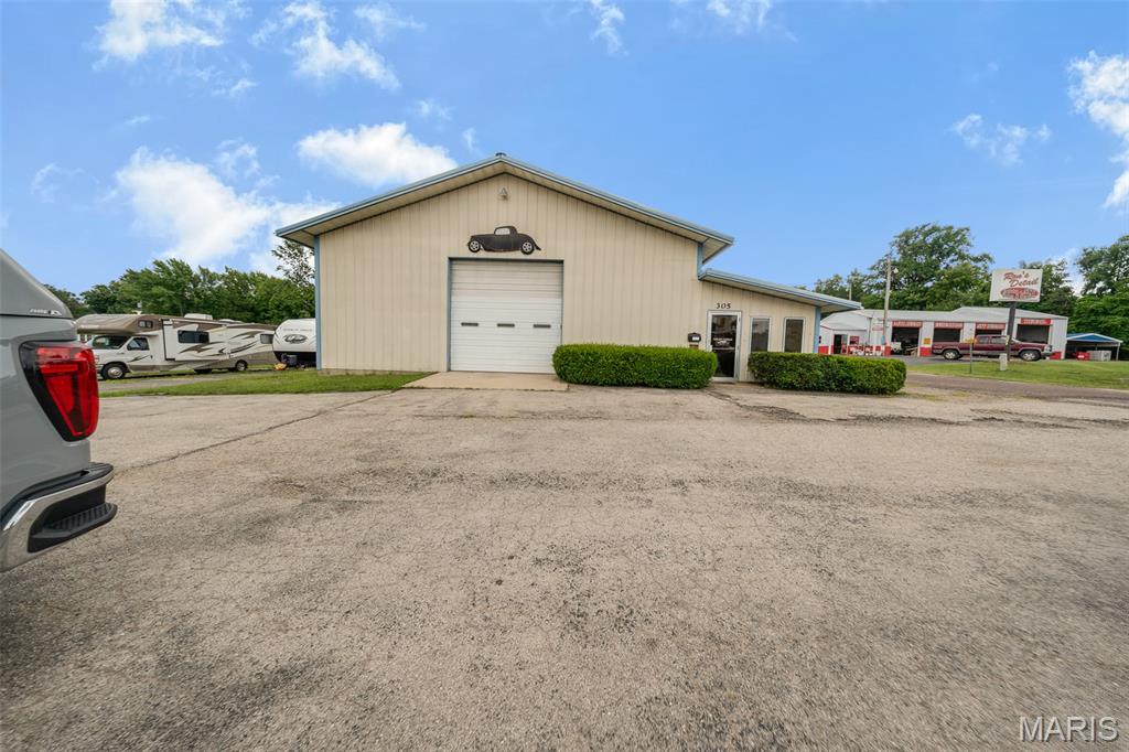 Excellent opportunity to own a versatile commercial automotive building situated on 0.40 acres m/l at a prime location! Zoned commercial in the heart of Salem, this property is well-equipped for an automotive repair shop, body shop, detailing business, or a variety of other commercial uses. The spacious shop features durable concrete floors, three overhead doors for easy access, all-new LED lighting, an exhaust fan with attic access, and an existing paint booth that can remain or be removed to suit your business needs. The office area includes a private office, one restroom, and a window A/C unit, providing a comfortable workspace while the main shop offers an open layout ready for customization. Whether you're expanding your current operation or launching a new business, this property offers the flexibility and functionality to make it your own. Schedule your private showing today!