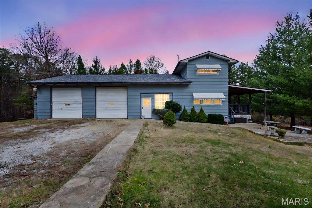 Private 11+ Acre Property With 3 Bed, 2.5 Bath Home Near Potosi
Just off Hwy 8 West, this two-story home offers room to spread out—both inside and out. The main floor features a spacious living area that opens to a large covered deck overlooking the property. The attached 2-car garage offers extra height suitable for a car lift and is heated by a wood stove, making it ideal for projects year-round.
This property includes two carports and more than 11 acres of land ready for recreation, homesteading, or future improvements. Major updates include a new septic system (2 Years) and well pump installed (6 months) For added opportunity, the property includes two rental pads—one occupied and one available. Ask for additional information. Located just a short drive from Fourche Valley Golf Course, Huzzah Valley Resort, YMCA Trout Lodge, Bass River Resort, and Mark Twain National Forest, offering easy access to floating, hiking, camping, and countless outdoor activities.