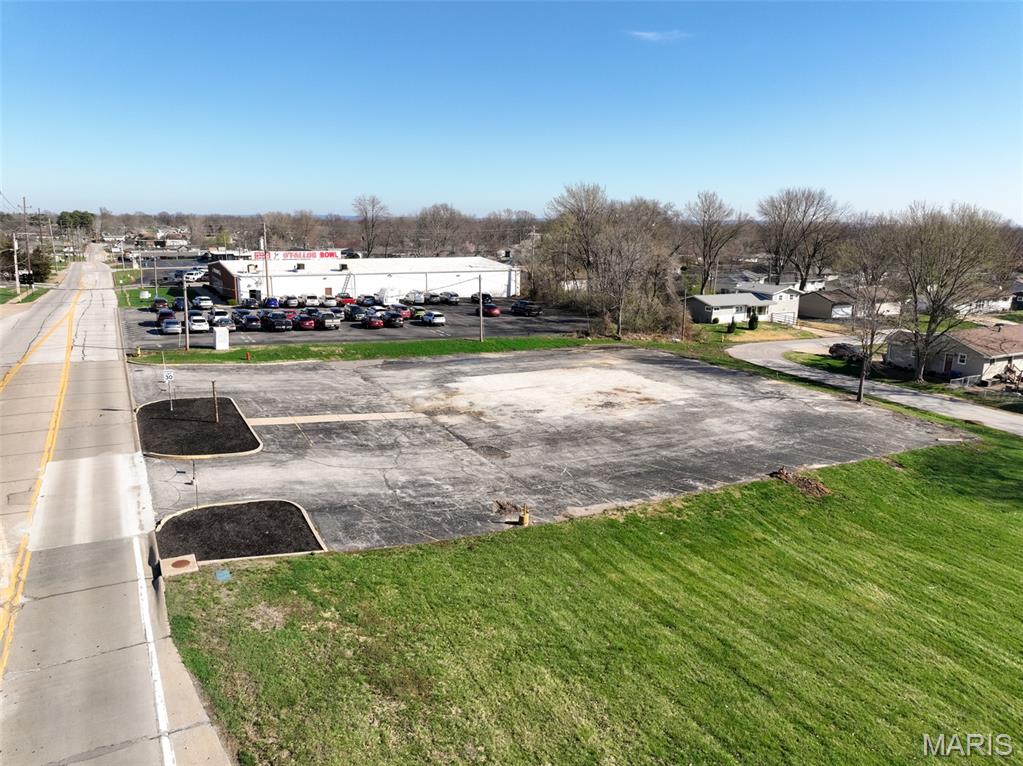 Don’t miss this incredible LOCATION! This 1.38+/- acre property offers outstanding potential for redevelopment in the heart of O’Fallon. Positioned in a rapidly growing area, the site benefits from convenient access to Highway K and I-70, providing excellent connectivity and visibility for a variety of potential uses. The property is within walking distance to Fort Zumwalt Middle School and is surrounded by established residential neighborhoods, creating strong demand and opportunity for future development. Whether you’re an investor, developer, or business owner looking for a prime location in a thriving community, this property is a must-see.