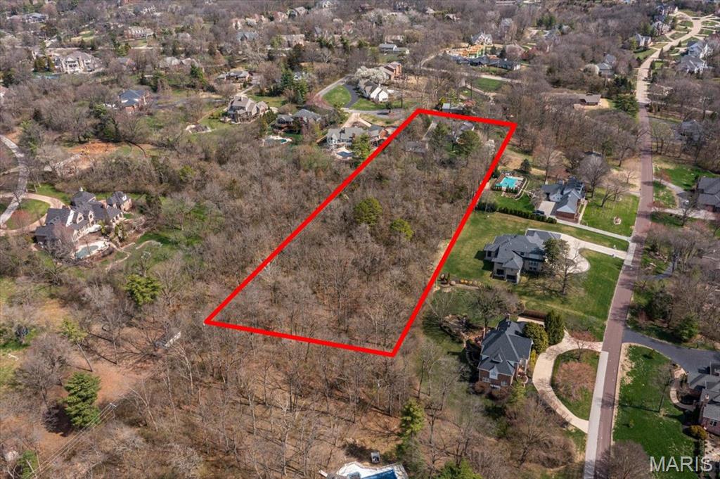 Nestled in the heart of Town and Country just off Topping Road, this exceptional 3.75-acre property provides an ideal setting for your custom estate.  With plenty of mature trees for privacy, this setting is so peaceful yet conveniently located only minutes from major highways.  This rare homesite is the perfect place to bring your vision to life!  The existing structures on the property are considered tear-downs.