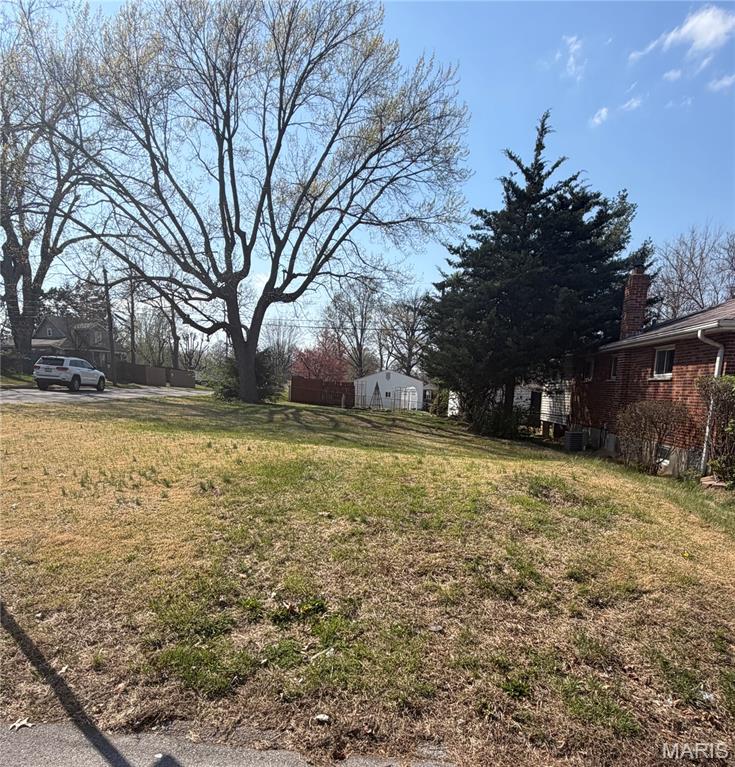 Beautiful vacant corner lot ready for your next home! Ideal for a single-family residence and conveniently located just minutes from the airport, making travel a breeze. Great opportunity to build now or in the future.