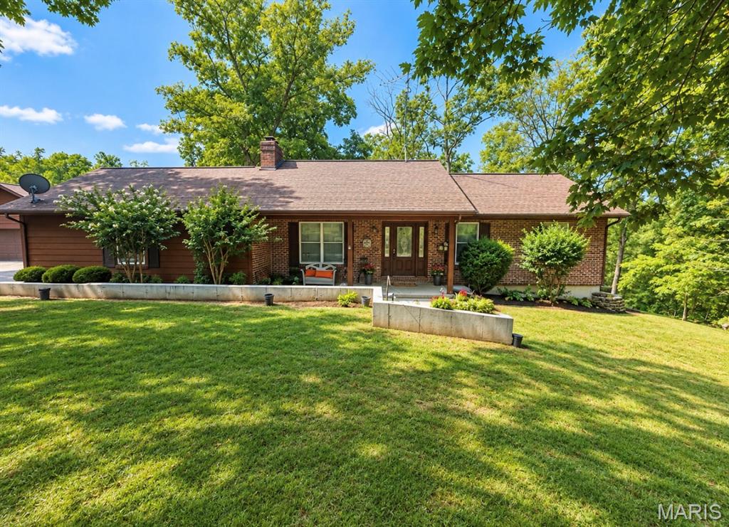 Welcome to this spacious 3-bedroom, 2-bathroom home situated on over 8 acres, offering a beautiful private setting with a desirable mixture of open ground and wooded acreage. With a year-round creek, multiple garages, generous storage, and plenty of room to spread out, this property offers a unique opportunity for anyone looking for privacy, space, and versatility. The main level features two bedrooms and one full bathroom, along with a comfortable living room complete with a wood-burning fireplace that creates a warm and inviting atmosphere. The kitchen provides plenty of cabinet and counter space, while the separate dining area offers a dedicated place for meals and entertaining. The spacious primary bedroom includes a walk-in closet, providing excellent additional storage. The finished basement expands the living space and features a bonus family room, additional bedroom and bathroom space, a wood-burning stove, and a dedicated storage room. With both walk-up and walk-out access, the basement offers added convenience and flexibility. Step outside from the lower level to a private back patio, perfect for relaxing and enjoying the peaceful surroundings. Outside, the home features a covered front porch and a spacious back deck overlooking the property, providing beautiful views of the wooded and open acreage. Whether you are enjoying your morning coffee, entertaining guests, or simply taking in the quiet setting, there is no shortage of outdoor space to enjoy. Parking and storage are another major highlight. The property includes a 2-car attached garage as well as an additional detached 2-car garage, providing room for extra vehicles, equipment, recreational toys, or workshop space. Both garages offer additional storage rooms above, giving you plenty of space for seasonal items, tools, decorations, and more. This property also features a bonus wood burning stove in the basement. There is also a artesian well located on the property. With over 8 acres, a year-round creek, wooded areas, open land, multiple garages, finished living space, and abundant storage, this property offers the flexibility to fit a variety of lifestyles. Whether you are a first-time homebuyer looking for room to grow or someone dreaming of a homestead, this property provides the space, privacy, and possibilities to make it your own.