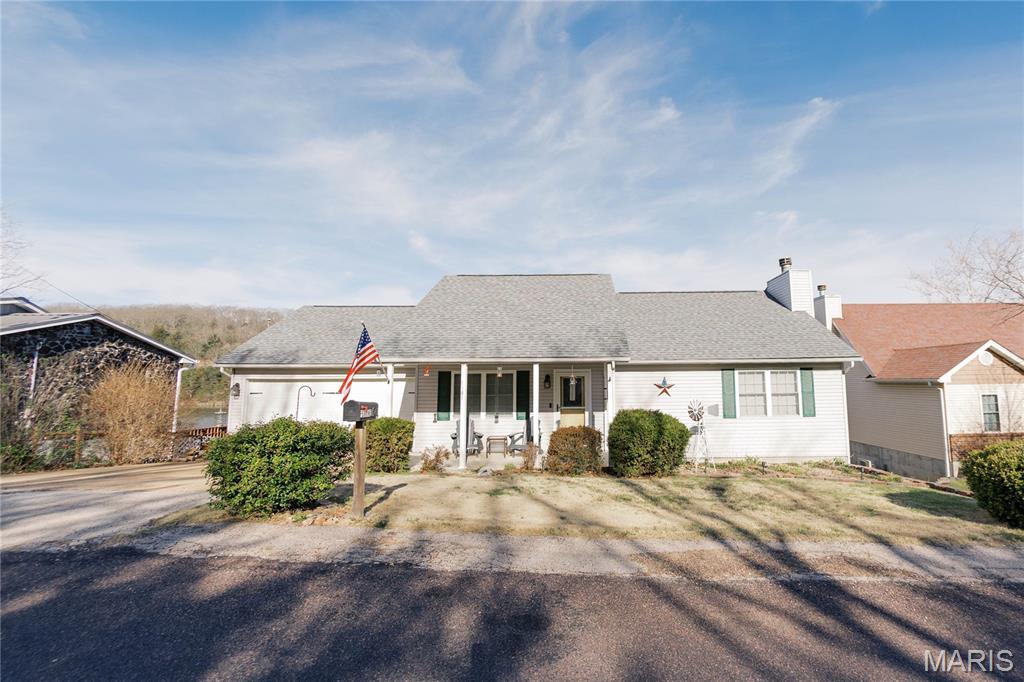 Beautiful waterfront home at Peaceful Valley Lake Estates, 3 BR. full finished basement with brick fireplace, large storage room and so much more.