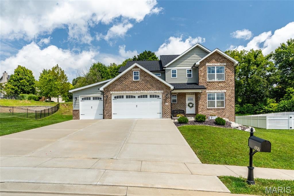 Welcome to this beautifully maintained 4 bedroom, 4 bathroom home nestled on a great lot within the highly sought after Edwardsville School District! Originally constructed in 2023, this home has been lovingly cared for and offers the feel of a newer home with thoughtful updates and spaces designed for everyday living.

The open floor plan features spacious living areas, abundant natural light, and beautiful finishes throughout. The main level offers a dedicated office/den, a convenient drop zone and mudroom just off the garage, and an inviting living space that flows seamlessly into the kitchen and dining areas. One of the home’s standout features is the completely transformed office/library, featuring gorgeous custom built-in bookshelves and a cozy reading nook that creates the perfect space to work, relax, or get lost in a good book.

Upstairs, the spacious primary suite features a vaulted ceiling and private en-suite bathroom, along with one additional bedroom, home library room, a full bathroom, and conveniently located laundry. The finished lower level adds even more living space with a large family room, fourth bedroom, and full bathroom, making it ideal for guests, entertaining, or additional living needs.

Step outside to enjoy the covered deck and spacious yard, perfect for relaxing or spending time outdoors. Conveniently located near shopping, schools, commuting access points, MCT bike trails, the library, and everything Edwardsville has to offer. This well-maintained home combines modern construction, thoughtful spaces, and an exceptional location within the Edwardsville School District. Don’t miss the opportunity to make it yours!