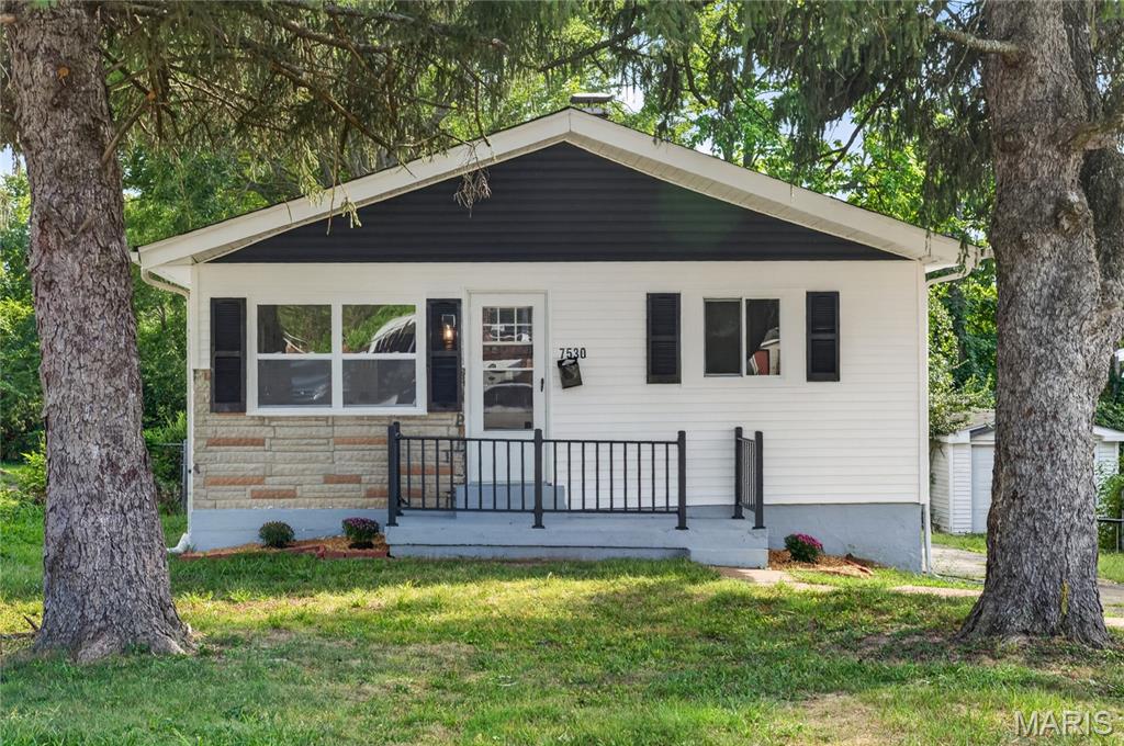 Stunning renovation in University City! If you're searching for a home with every detail intentionally designed, welcome to 7530 Trenton Avenue. Step inside to new LVP flooring, recessed lighting and fresh paint throughout the main floor. The spacious living room flows into the dining area, then turns to the showstopper - a reimagined kitchen space with two-tone, soft-close cabinetry, gleaming quartz countertops, and stainless steel appliances. Don't miss the new wall-mounted range hood, featuring three fan speeds, touchscreen controls, and LED lighting! Continue exploring to discover the beautiful tile surround in the bathroom, three generously sized bedrooms, and ample storage space and even more opportunity for your personal touch in the clean and dry basement. With a brand new roof, new vinyl siding, and a large, fenced-in back yard, 7530 Trenton checks every box. Welcome home!