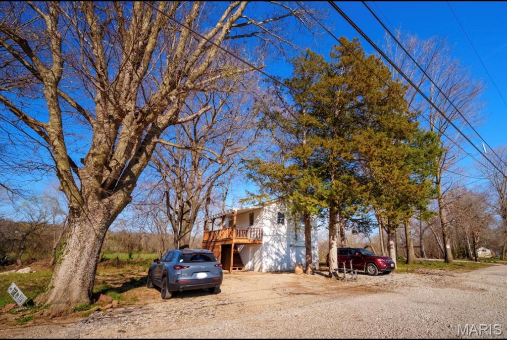 Looking for peace, privacy, and a place to fish right out your back door? This charming riverfront home offers exactly that. With steps leading down to Big River, this 2 bedroom, 1 bathroom home is the perfect retreat for anyone who loves the outdoors, quiet mornings, and relaxing water views. In the front, you’ll enjoy scenic farmland views that add to the calm, country feel. Inside, the home offers over 600 square feet of efficient living space, plus a basement garage for storage or parking. Updated panel, roof, furnace, septic field and steps down to the river. Even with its serene setting, you’re only 2 minutes from Highway 30, making this a rare combination of convenience and getaway vibes.