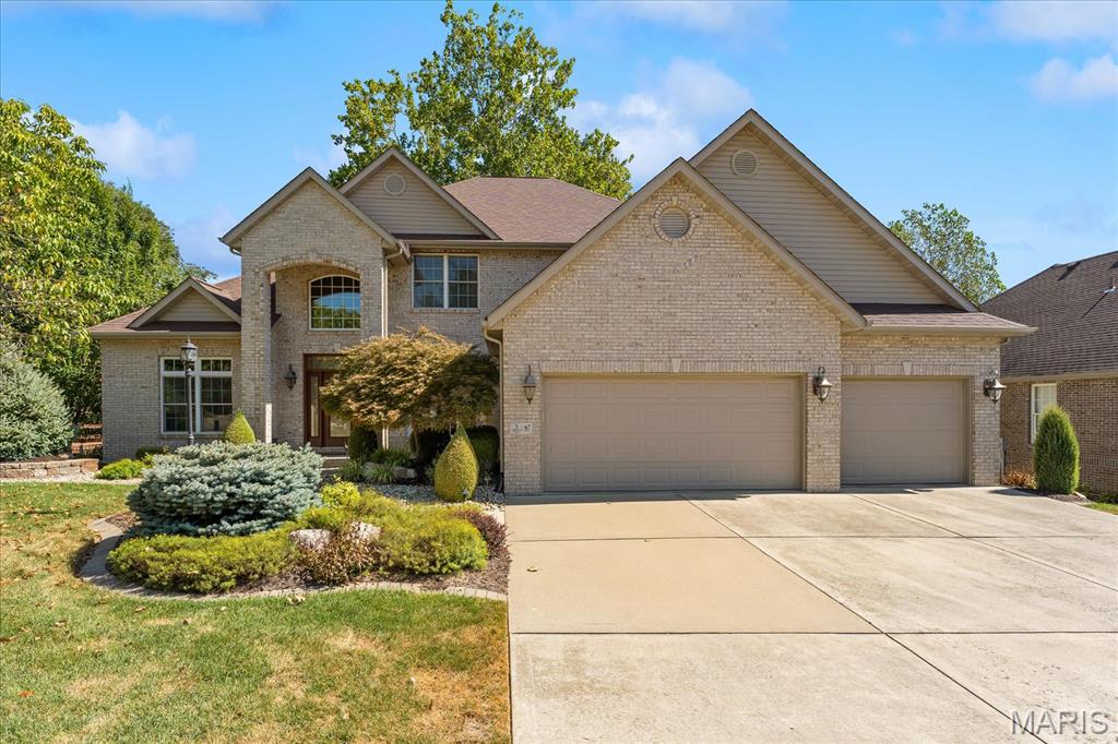 Nestled in the desirable Timberwolf Estates subdivision of Glen Carbon, Illinois, this well-maintained five-bedroom, four-bathroom home offers exceptional curb appeal with beautifully manicured landscaping and a serene, tree-lined backyard.

Step through the inviting front entryway into a thoughtfully designed main level featuring a formal dining room and a great room boasting soaring ceilings that create an open, airy feel. The kitchen offers stainless steel appliances, granite countertops, and a spacious eat-in area that flows seamlessly to a partially screened deck.

The main-floor primary suite is a true retreat, offering a large walk-in closet and an ensuite bath with a jetted soaker tub, tiled shower, and double-sink vanity. Direct access from the primary bedroom to the deck adds a private touch of luxury. The main level also features a large laundry room with cabinets and a utility sink and an oversized three-car garage.

Upstairs, you'll find three additional generously sized bedrooms and a full bathroom, offering plenty of space for family or guests.

The finished lower level expands your living space even further with a spacious family room featuring 9+ foot ceilings, a wet bar, and access to a covered rear patio. This level also includes a large fifth bedroom, a full bathroom, a versatile bonus room, and ample storage space.

Seller is offering a 1 year VIP level Guard Home Warranty
Sellers will need a closing date of late November or first week of December.