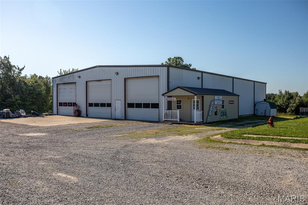Searching for the ultimate all-in-one property for your business? This exceptional 3.92-acre property offers over 20,000 square feet of versatile space designed to accommodate a wide range of commercial, industrial, and residential needs. The property features approximately 13,680 square feet of warehouse, garage, and shop space, a 4,312-square-foot office complex, and a spacious 2,409-square-foot living quarters apartment.
The beautifully finished apartment is located above the office complex and could also serve as an expansive executive office suite, creative studio, or workspace. The warehouse and shop areas include approximately 5,000 square feet attached to the main complex, with an additional 1,680-square-foot building and a separate 7,000-square-foot building, providing flexibility for operations, storage, manufacturing, or multiple business ventures.
With nearly four acres of land and endless possibilities for expansion or future development, this unique property is a rare opportunity for business owners, investors, or entrepreneurs looking for a true multi-purpose facility. Schedule your private showing today!
