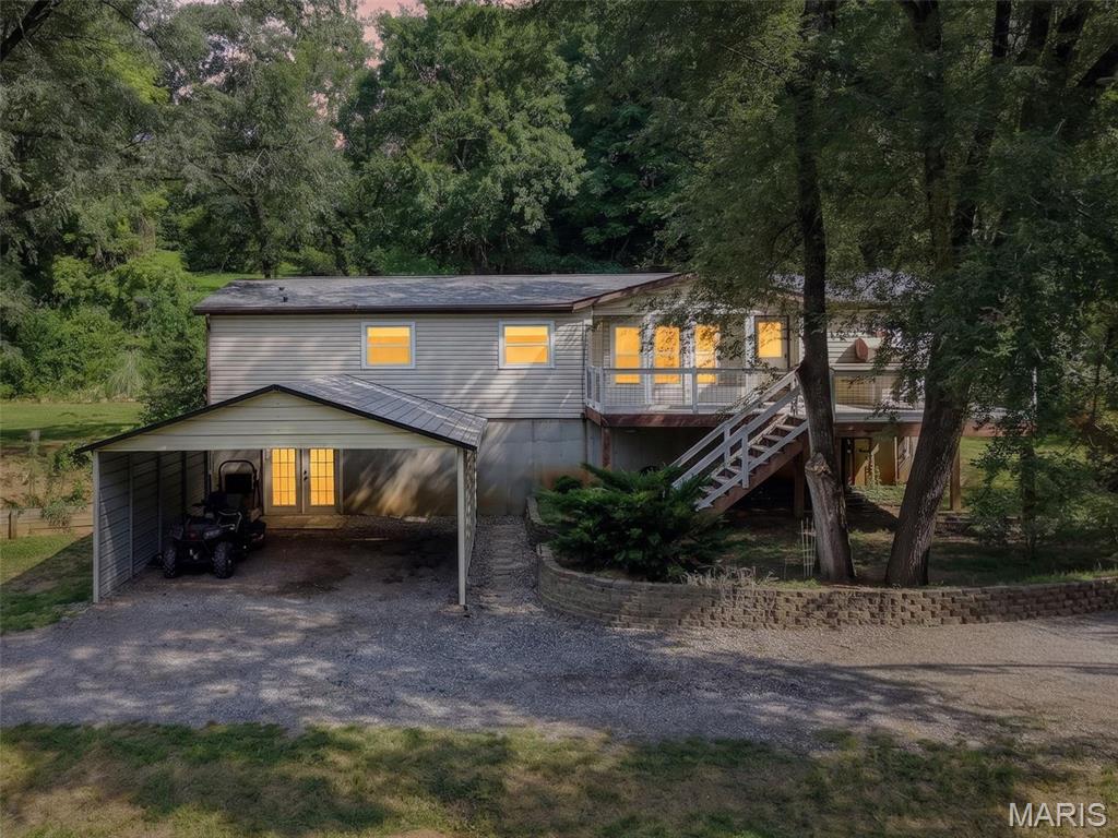 This Beautiful Ranch home that sits on 5+ acres is exactly what you’ve been searching for 2 bed plus office with 2 bath! Your own slice of paradise offers peaceful and serene views, plenty of level lot space and wooded areas with hiking/hunting trails!  Curl up with a book in the hammock or enjoy the weather and privacy on this amazing dream deck!  The amazing home features new AC unit, Updated kitchen and baths, open concept living, picture windows, vaulted ceilings, fireplace and main floor laundry! Kitchen is spacious and open with plenty of counter space, center island/breakfast bar, sky light, SS appliances and perfect for entertaining. Dining area offers large bay windows with tons of natural light overlooking the deck! Master suite has large closet and full bath with double sinks, shower and soaking tub. Walk out LL offers plenty of space for all your fun toys, a workshop, storage and endless possibilities!