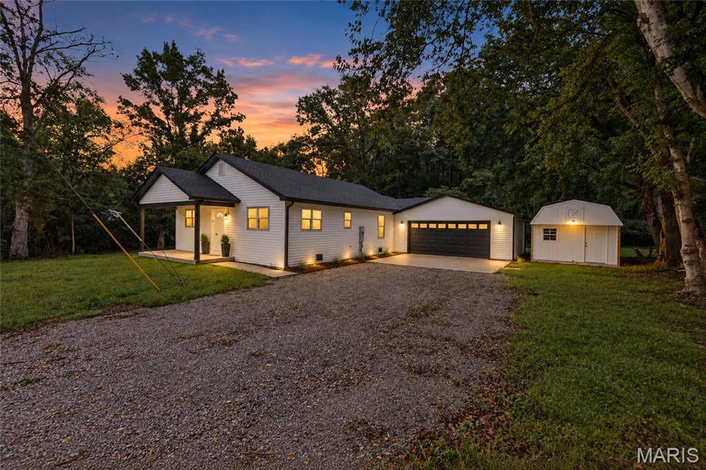 BRAND NEW HOME IN ESTABLISHED AREA. COUNTRY FEEL BUT CLOSE TO SHOPPING MALL, CINEMA AND RESTAURANTS. LARGE COVERED FRONT PORCH (18 X 6) HAS RECESSED LIGHTING. UPON ENTERING THE HOME YOU SEE THE EXSPANSIVE LIVING ROOM/DINING ROOM AREAS WITH CATHEDRAL CEILINGS, MODERN CEILING FANS AND RECESSED LIGHTING. VERY FUNCTIONAL KITCHEN HAS PLENTY OF WHITE CABINETRY WITH QUARTZ COUNTERTOPS. LARGE DEEP SINGLE SINK. SS MICROWAVE AND DISHWASHER. PRIVATE PRIMARY SUITE HAS HUGE 9 X 5 WALK-IN CLOSET AND FULL BATH. FULL HALL BATH. TWO ADDITIONAL BEDROOMS ROUND OUT THE REST OF THE LIVING SPACE. LUXURY VINYL PLANK THROUGHOUT. CARPETING IN THE BEDROOMS. UTILITY ROOM HOUSES THE FURNACE, TANKLESS WATER HEATER AND LAUNDRY HOOKUPS. MASSIVE 24 X 24 ATTACHED GARAGE HAS BACK DOOR THAT LEADS TO BACK YARD. HANDY 12 X 16 SHED INCLUDED.  HALF ACRE LOT HAS MATURE TREES SURROUNDED BY WOODED AREAS. MAKE THIS BEAUTIFUL HOME YOURS!! AGENT RELATED TO SELLER.