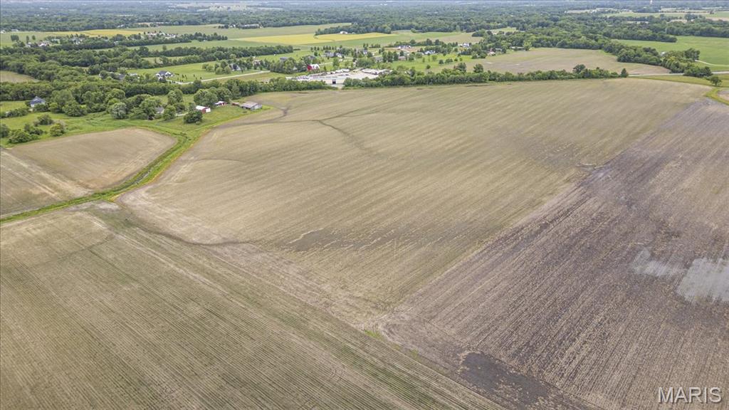 Rare opportunity to purchase large tract of farmland in the desirable Edwardsville School District of Madison County, Illinois in the St. Louis Metro-East, just minutes from downtown Edwardsville, near I-55. 57.45 acres of high-yield, tillable, income-producing farmland with nearly 1,400 feet of frontage along State Route 157, historic Route 66. Perfect for farmers looking to expand their operation, investors seeking income or development opportunities, or individuals dreaming of starting a family farm. This location means big sky and wide-open space without sacrificing convenience. Currently zoned agricultural. Continue leasing it to a local farmer for passive income, farm it yourself, build your dream home, or start that family compound to live off the land and prepare for the apocalypse. Showings by appointment only. For more information, contact the listing agent. Buyer should independently verify all data.