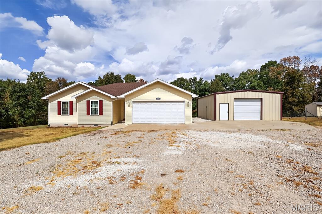 Welcome to this well-maintained 4-bedroom, 2-bath home nestled on 3.89 beautiful acres at the end of a quiet dead-end road, offering outstanding privacy and peaceful country living. The property is surrounded by woods that attract abundant wildlife, making it perfect for nature lovers or even a little hunting right out your back door. In addition to the attached 2-car garage, you'll appreciate the 24' x 30' detached shop, providing plenty of space for hobbies, equipment, or extra storage. Inside, you'll find a home that has been lovingly cared for with fresh paint, brand-new carpet, and a recently updated primary bathroom. Whether you're looking for room to spread out, a private setting, or a move-in-ready home with acreage, this property offers the perfect combination of comfort, functionality, and country charm.