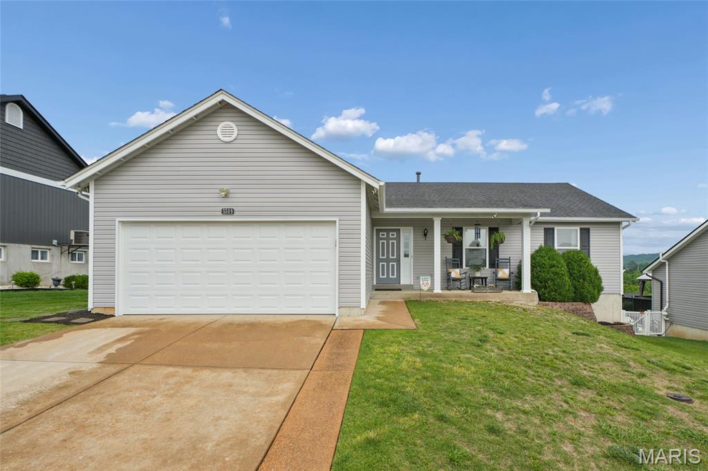 Clean, well-maintained two-owner ranch in Valley Oaks.  Huge, 393 sq/ft deck with great valley view built in 2022.  New architectural shingle roof in 2025.  Builder extended foundation 2' for additional square footage along rear of home, and 6' additional garage depth to accommodate small boat and trailer.  Large master bedroom suite with bay window, crown molding, and ensuite bath that includes walk-in shower and linen closet.  Great room showcases cathedral ceilings and wood-burning fireplace.  Kitchen features some newer stainless steel appliances, double sink, and gas range.  Breakfast room gets good natural light with southwest facing window and sliding door that leads to deck.  Hall bath with shower/tub combo.  Walk-out lower level provides another 1,000+ sq/ft of living space with a large family room, a bonus room that includes a wet sink and cabinets, and a full bath with walk-in shower and linen closet.  Lower level family room and bonus room have egress windows for a potential fourth bedroom.  Good-sized lower level laundry room with built-in shelving.  Utility room doubles as a workshop and storage with more built-in shelving.  17'x8' patio with stairs to recently re-stained deck (2026).  Very usable, nearly level backyard.  Garage has some nice extras with ample built-in storage shelves, new garage door in 2026, attic fan, and attic stair access.  New gutters, downspouts, and majority of vinyl siding in 2025.  Seller is offering a 1-year Choice Ultimate Home Warranty with the sale. Convenient highway access.  Less than 2.5 miles to all three levels of Seckman schools.  Downtown Kimmswick is less than 12 minutes by car.  Nearby Mastadon State Historic site has popular local trails, a playground, and creek access.  Floor plan located in virtual 3D tour.