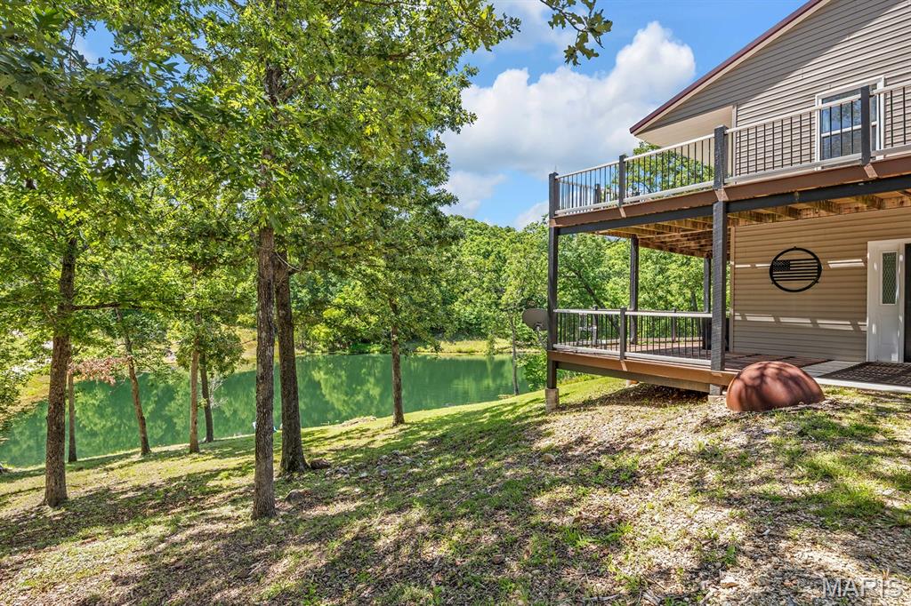 Private Hunting & Fishing Retreat on 25 Wooded Acres! Escape to your own private hunting and fishing retreat on 25 beautiful, wooded acres, complete with abundant wildlife and a picturesque one-acre stocked lake. Lovingly enjoyed by the current owners for many years, this property has seen multiple updates and is ready for its next chapter and many new memories. The spacious 3-bedroom, 3-bath home offers additional sleeping rooms and a flexible layout with the potential for separate upper and lower-level living. A beautifully updated new kitchen is a standout feature of the main level, complemented by an open floor plan designed for gathering and enjoying the peaceful surroundings. The main-floor master suite includes a private bath, walk-in closet, and laundry area, while an office or nursery adds even more flexibility. The lower level offers its own living room and dining area, two bedrooms, an additional sleeping room, and a hobby room. A kitchen could easily be added back to create a second independent living space, perfect for extended family, guests, or a hunting camp set up. Enjoy the outdoors from the wraparound porch, with beautiful views of the lake and surrounding woods. The low-maintenance exterior features vinyl siding and a metal roof. For the outdoor enthusiast, this property is hard to beat. The wooded acreage provides excellent opportunities for hunting, wildlife watching, hiking, and exploring, while the stocked one-acre lake is ready for fishing, relaxing, and making memories around the water. Whether you're looking for a weekend getaway, hunting and fishing camp, or a full-time private homestead, this property offers the space and recreation you've been searching for. A 30'x40' metal shop with concrete floor and interior office space provides plenty of room for ATVs, hunting gear, fishing equipment, tools, and recreational toys. Privacy, updated living space, abundant wildlife, and your own stocked lake, this is the kind of property where weekends turn into memories.