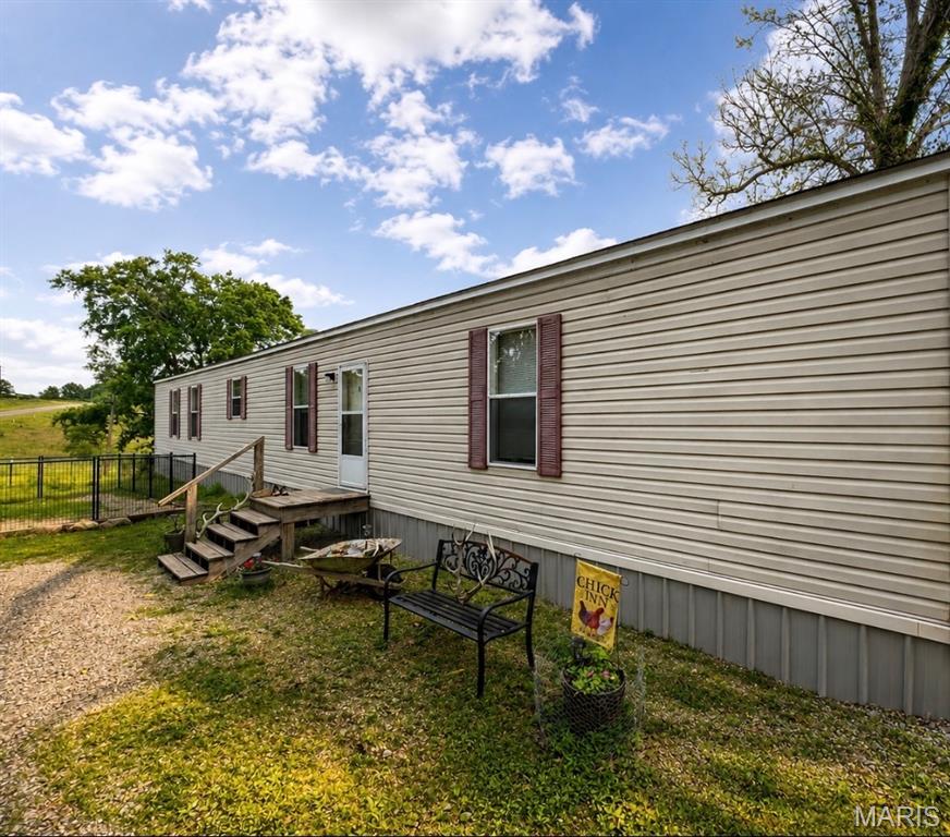 Very attractive well maintained 3 bed- 2 full bath home, new granite counter tops and new laminate flooring throughout most of the home on 8 ac. m/l, fenced, small cabin on property, indoor/outdoor dog kennels, chicken coop, fenced & cross fenced so there is plenty of room for a couple horses and sheep. So much to offer with this home. Call to see this property.