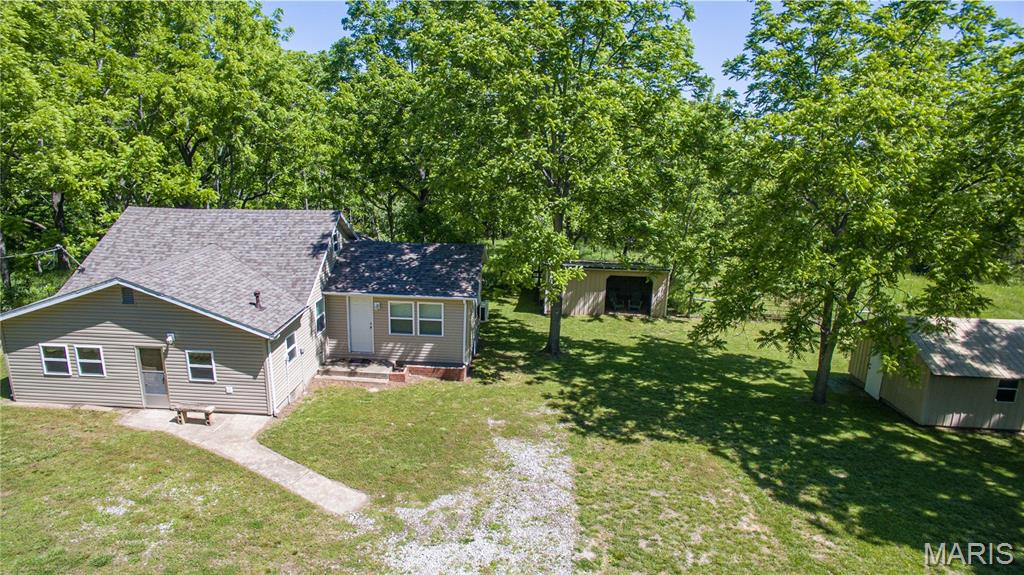 Escape the hustle and welcome home to your own 8.4-acre private countryside retreat. Fully fenced and ready for your vision, this charming 3-bedroom, 1-bath home features a versatile bonus room (perfect for a non-conforming 4th bedroom or home office) and beautiful natural wood accents that radiate rustic warmth.

You get the best of both worlds here: timeless character paired with major updates, including a brand-new roof, siding, windows, gutters, blinds, and four new mini-split heater/AC units. Outside, the expansive acreage is a blank canvas for gardening, hobby farming, or just enjoying the peace. The property also boasts multiple powered outbuildings—ideal for a workshop or extra storage—plus a ready-to-use chicken coop for your future flock. Secure, private, and packed with personality, this mini-homestead is a rare find. Back on market due to no fault of the seller. Act fast—opportunities like this don't stay on the market long!
