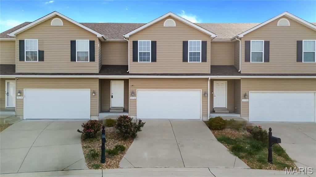 Welcome home to this spacious 2-story townhome offering over 1,500 square feet of living space, fresh interior paint, new LVP flooring in the kitchen and breakfast room, and a convenient 2-car attached garage! Step inside to a welcoming foyer that opens to a spacious living room and flows seamlessly into the kitchen and breakfast area, featuring ample cabinet and countertop space along with the newly updated flooring. Upstairs, you'll find an oversized primary bedroom with his-and-hers closets, along with two additional generously sized bedrooms, including one with a walk-in closet. A full bathroom is conveniently located down the hall and serves all three bedrooms. The full unfinished basement offers plenty of room for storage, a workshop, home gym, or future finished living space. Step outside and enjoy your private patio, perfect for morning coffee or relaxing at the end of the day. Conveniently located near shopping, dining, parks, and major commuter routes, this freshly updated, move in ready townhome offers a great combination of space, functionality, and value.