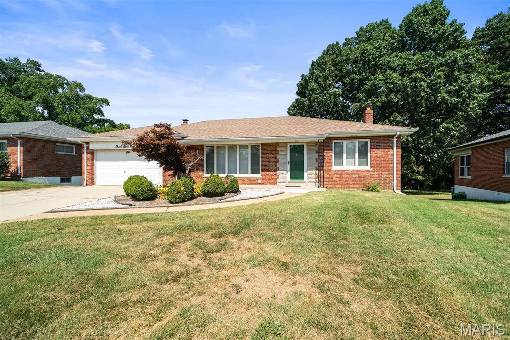 Welcome to a wonderful 2-bedroom home in Lindbergh school district!  This is a Full masonry home.  From the garage you enter the family room that is surrounded by windows and has a gas fireplace.  The kitchen opens to the family room and also has a lot of light and stainless-steel appliances.  The 2 bedrooms, living room and hall have original hardwood floors that are in great condition! There is a covered deck overlooking one of the deeper back yards in the neighborhood. Bath and laundry in lower level. The basement walks out to the back yard and makes a great entertainment space.   This house lives large for its size!