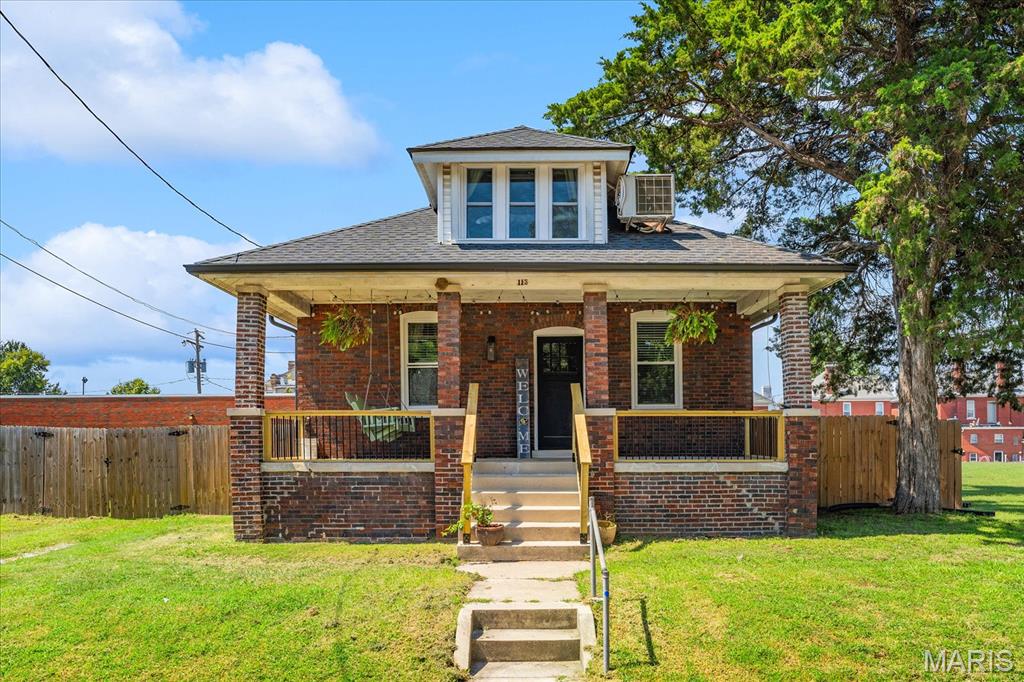 Welcome home to this charming, all-brick bungalow in a fantastic downtown location, just a short walk to the entertainment district, restaurants, shops, and community events. From the moment you arrive, the darling front porch welcomes you and offers the perfect spot to enjoy your morning coffee or relax and watch the world go by.

Inside, this home beautifully blends classic architectural character with modern updates. You'll find gorgeous woodworking details, built-ins, and the craftsmanship that gives this home its unique personality. The upstairs has been newly renovated, providing additional flexible living space. The dormer rooms are currently being used as offices but could easily be converted into closets or additional storage to fit your needs.

Outside, enjoy the new privacy fence and the charm of the brick exterior. The fenced yard provides a private space for relaxing, gardening, or entertaining.

With its character, thoughtful updates, darling front porch, and walkable downtown location, this bungalow offers the best of both worlds—timeless charm with modern convenience, right in the heart of it all!