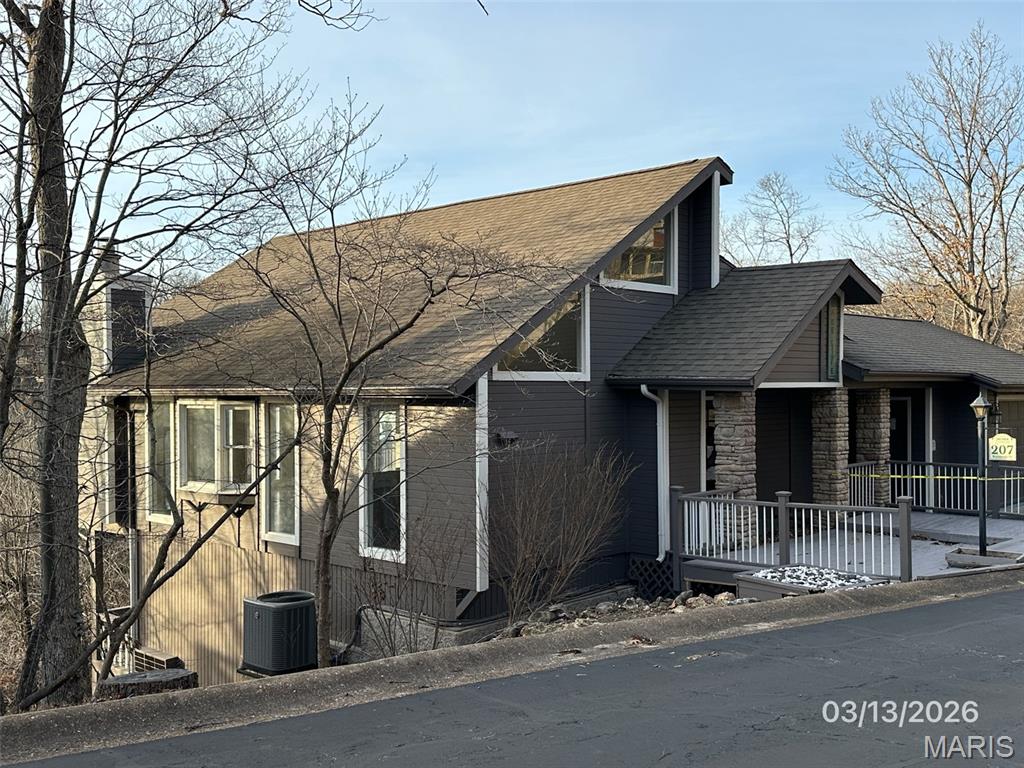 This property is eligible under the FreddieMac First Look initiative through 06/19/2026. BEING SOLD AS-IS 3 BEDROOM, 3.5 BATH WITH LAKE VIEW REMODELED IN 2025 TWO CAR OVERSIZED GARAGE. SUNROOM BETWEEN LIVING AREA AND DECK ON MAIN LEVEL. LOWER LEVEL HAS OUTSIDE PATIO.HOME HAS  MINI SPLIT H/A. HARDWOOD FLOORS AND WOOD BURNING FP IN LIVING AREA BUILT IN CHINA STORAGE IN DINING AREA. LOTS OF WINDOWS.