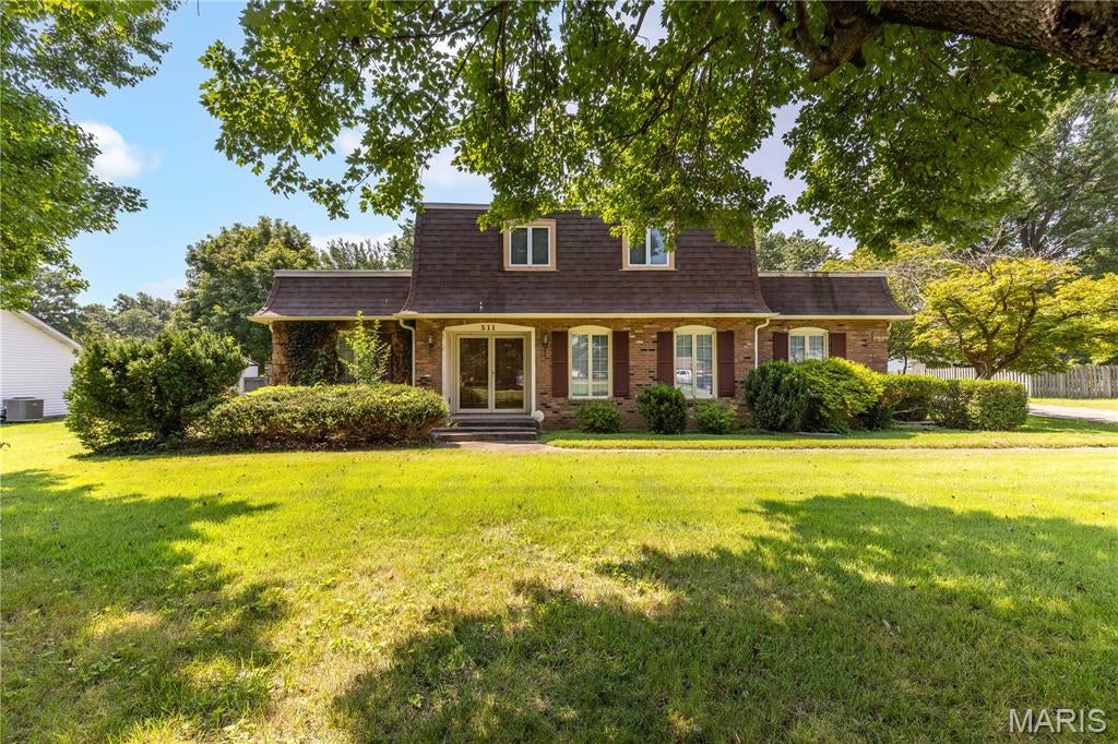 Be the first to see this large family home; room for everyone and everything!  Features formal living room and dining room; 4 bedrooms, 4 baths. Large entry foyer leads to living room and family room. Kitchen with breakfast area has tile floor. Entrance from garage has laundry room and 3/4 bath.   Large family room with built-in bookshelves and wood burning fireplace with raised hearth, gas log insert with propane tank available.  Primary bedroom and bath on the main level, walk-in closet and two other closets. Second floor has 3 bedrooms and two baths.  894 sf minimal finish Basement has sump pump and separate walk up to garage. Front porch, new deck off upstairs bedroom, and extra large patio for your outdoor enjoyment.  Workshop has electricity and wall air conditioner.  Separate HVAC units on each level, both serviced in 2026.  New garbage disposal. Lawn sprinkler system, however, recent owners did not use it, and condition is unknown. Rubber roof cover replaced in 2020.  Property to be sold in its present condition "as is".