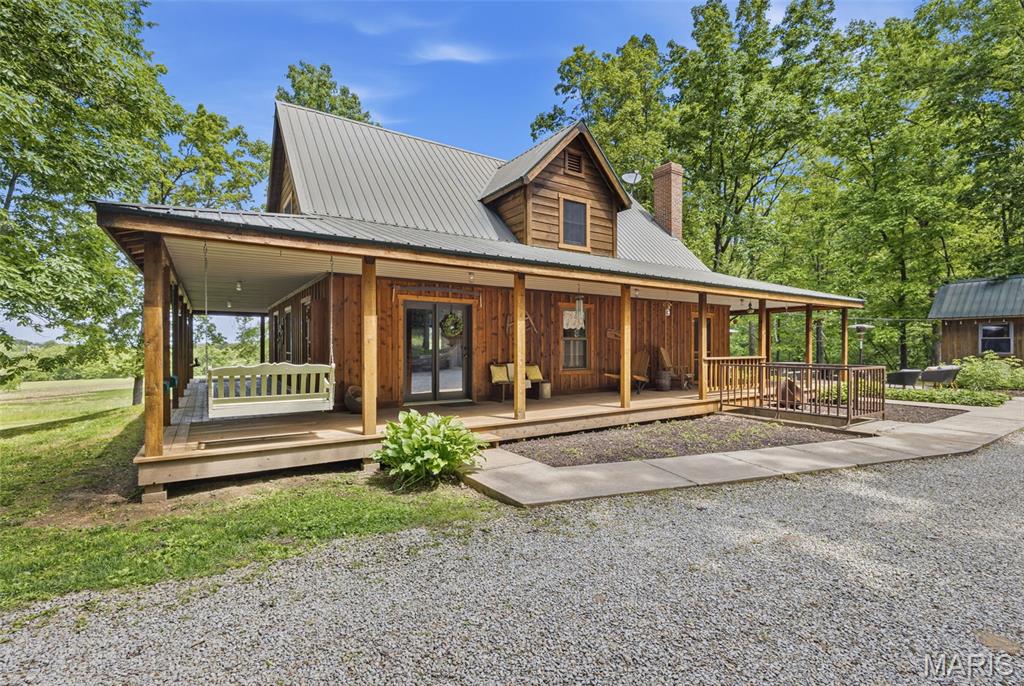 One of a kind 55 acre m/l immaculate farm/recreational retreat close to Farmington. This custom cedar home features 3 bedrooms, 2 1/2 baths with additional living space and bathroom above garage. Home has custom hickory cabinets, granite countertops, an in home vacuum system, and one of a kind fixtures throughout. Enjoy the large wrap around porch overlooking terraced rolling pasture which offers farming opportunities and beauty. Additional shed can be used for a garage. This stunning property features a pond and plenty of shaded areas for entertaining that includes a kid's playhouse and custom fire pit. Relax with family and friends on cool evenings around the fire. The property is a mix of pasture, tillable acreage, and established woods that have not been logged in over 100 years. Wildlife galore, monster bucks, and turkey populate the area (The proof is on the walls!) Would make a great hunting retreat/lodge! Minutes from Farmington surrounded by generational farms, this property presents an opportunity for farm, recreational, and homesite uses. Additional acreage and additional home available for sale.additional