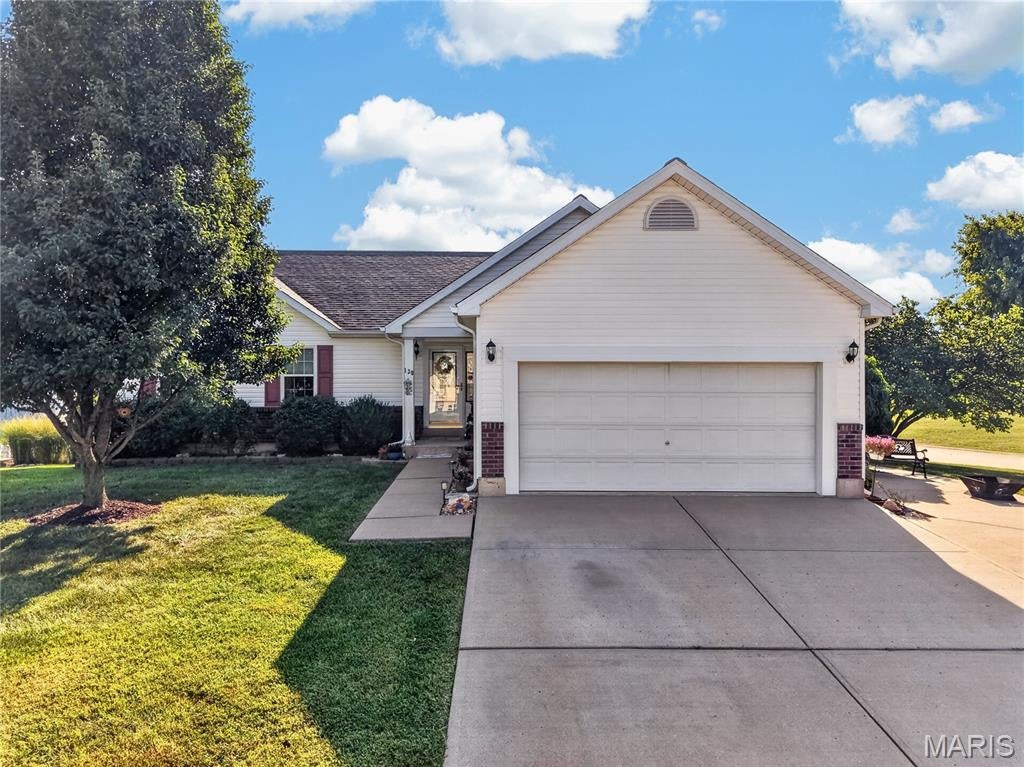 Fall in LOVE with the UPGRADED & FRESH FEEL of this 3 Bedroom, 2 Bath WALKOUT Ranch w/ 2 Car 25’ EXTRA DEEP Garage in the Desirable White Hawk Estates!
UPDATES GALORE! This OPEN FLOORPLAN offers 1,600 sq ft of Finished Living. Features include Luxury Hickory Wood Laminate Plank Floors throughout the main living area. VAULTED Great Room with a STUNNING Stone Wood Burning Fireplace that is the center of attention! Wood Beam Ceiling Detail, Ceiling Fan & Light, Plant Ledge & Wide Entry to the Kitchen & Dining add to the Open feeling!
EAT-IN Kitchen boasts Wood Cabinets w/ Designer Detailing, Tile Backsplash, Stainless Appliances, Can Lighting & a Wood Pantry Cabinet. Dining has Designer Lighting & Slider to the 12x18 Deck with Privacy Screens, Sun Cover & Stairs to the White Vinyl Fenced Backyard.
Owners Suite features a Fireplace, Designer Wall Detail, Walk-In Closet with Organizers & Spa-Like Bath w/ Jetted Tub, Garden Window, Designer Tile Walls & Floor, Full Size Shower w/ Seat, Shelf & Glass Doors, Elongated Toilet & Tall Wood Vanity with a Dual Sink Granite Top. Bedrooms #2 & #3 share a Hall Full Bath & Linen Closet. Main Floor Laundry w/ Wall Cabinets & Counter.
Open Stairs with Designer Iron Spindles leads to a Partially Finished Lower Level w/ Recreation Area, Hobby Cabinets & Counters, Utility Sink, Storage & Rough-In for Future Full Bath. Walkout the Glass French Doors to the Covered Rear Patio & GARDENERS DREAM! Custom Designer Container Gardening with Cedar & Aluminum Planters, Arched Trellis, Thoughtful Landscaping, Stone Paver Patio & Pathway. Extra Wide Concrete Driveway with Extra Pad Parking. Well maintained & MOVE-IN READY! Assurant 1-year Home Warranty included for added peace of mind!
Located in Troy Schools: Cuivre Park Elementary, Troy Middle & Buchanan High.
USDA FINANCING eligible! Only 6 miles from Hwy 61 for an easy commute while enjoying more home for the price. To get the FULL EXPERIENCE, you need to TAKE A TOUR TODAY!