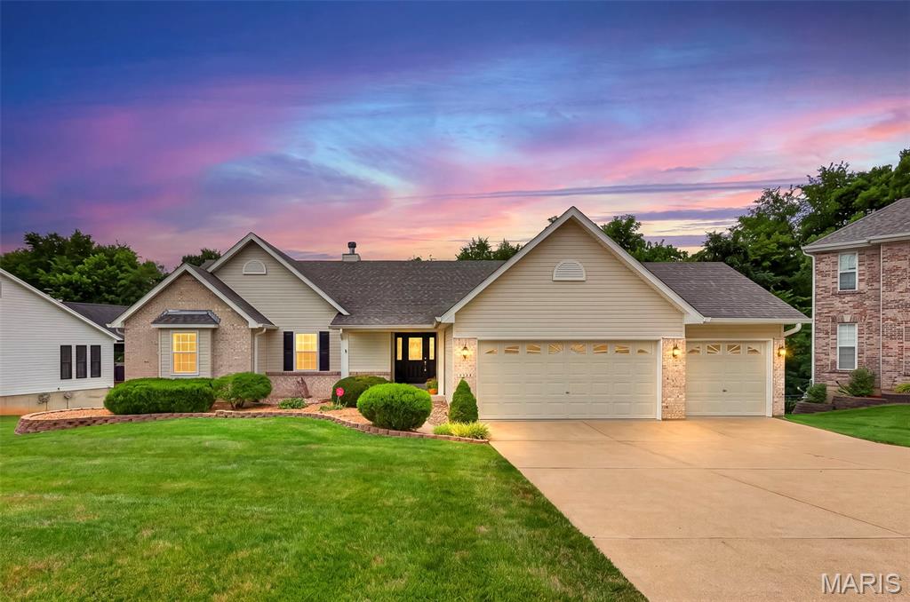 **OPEN SUNDAY 1-3PM**
Nestled in the desirable Benzel Meadows community and served by the sought-after Windsor School District, this beautifully maintained atrium ranch offers the perfect blend of comfort, style, and exceptional entertaining space. Backing to mature trees, you'll enjoy peaceful views, relaxing visits from neighborhood deer, and a private setting that feels like a retreat.

Step through the welcoming foyer and be captivated by soaring two-story atrium windows that flood the home with natural light. Gorgeous hardwood floors lead into the spacious great room, where a cozy gas fireplace creates the perfect gathering space. The open-concept design seamlessly connects the great room, breakfast area, and well-appointed kitchen, making everyday living and entertaining effortless. Step outside to the low maintenance, composite deck and enjoy your morning coffee overlooking the tree lined backyard. Enjoy holiday gatherings and memories made in the formal dining room.

The spacious primary suite is a relaxing escape featuring a walk-in closet and a luxurious ensuite bath with dual vanities, a separate shower, and a corner soaker tub perfectly positioned to take in the tranquil wooded views. Two additional bedrooms,  full hall bath, half bath and laundry room complete the main level. Enjoy the oversized three-car garage, adds everyday convenience.

The finished walk-out lower level is truly an entertainer's dream. The included pool table serves as the centerpiece of the expansive recreation room, complete with ceramic tile flooring featuring decorative inlay. A built-in wet bar with illuminated glass-front cabinetry creates the perfect setting for game nights, celebrations, or hosting friends. You'll also find a spacious 4th  bedroom, a third full bath, and abundant unfinished storage space.

Step outside to your patio and view of trees and privacy.

If you've been searching for a move-in ready home with an open floor plan, beautiful wooded views, and incredible entertaining spaces, this one checks every box.
