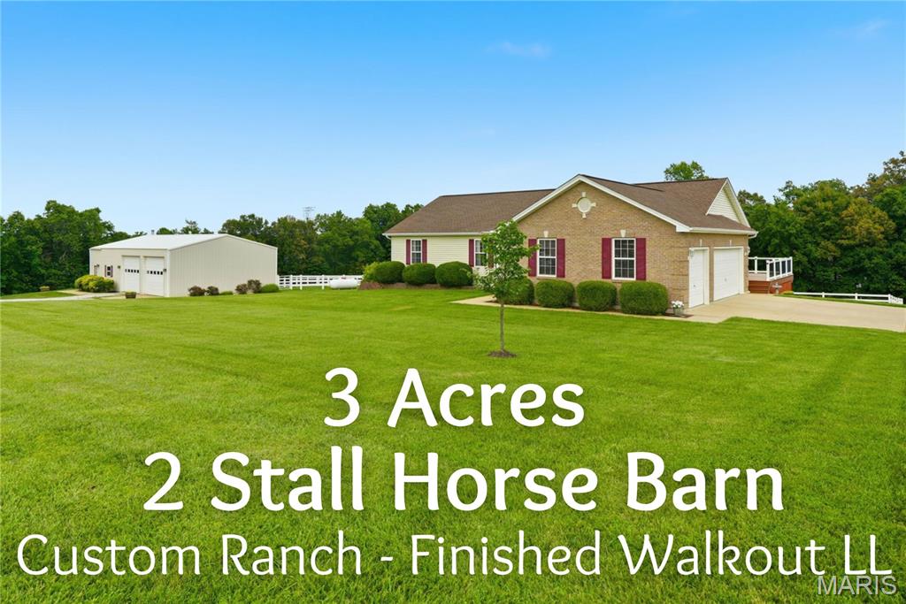 Bring the horses and settle into this beautiful equestrian retreat, featuring a custom ranch home, a 3-car side-entry garage, and a well-appointed 2-stall horse barn. Step inside to find gorgeous wood flooring flowing through the great room, breakfast room, kitchen, and hallway. The inviting foyer opens into a vaulted great room with a plant shelf and a cozy gas fireplace—perfect for relaxing evenings. The great room connects seamlessly to the breakfast room and kitchen, where you’ll find custom cabinetry, granite countertops, and a stylish custom backsplash. A convenient main-floor laundry sits just off the kitchen. The primary suite offers a peaceful escape with a walk-in closet and a luxury bath featuring double sinks, a separate shower, and a garden tub. Two additional bedrooms and a second full bath complete the main level. The finished walkout lower level expands your living space with a recreation room, family room, third full bath, and a huge den—easily a possible 4th bedroom with the addition of a closet. Enjoy outdoor living on the maintenance-free 32x12 deck or the expansive patio, ideal for gatherings with family and friends. Horse lovers will appreciate the 50x30 barn with concrete floors, electricity, an office, hayloft, and two 14x14 stalls, plus white fencing and electric fencing already in place. All of this sits just over the Lincoln County line, offering the perfect blend of country charm and convenience.