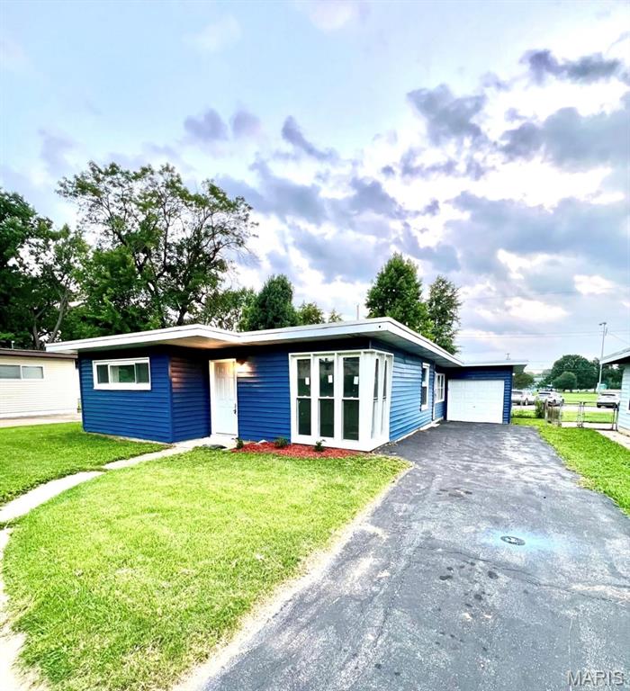 This newly renovated home features fresh paint throughout and backs to a park, offering convenient access to green space that's great for children, pets, and family outings. The property has been extensively updated with many major improvements already completed, including an open-concept layout, a fully remodeled kitchen with granite countertops, custom cabinets, stainless steel appliances, a permitted laundry area, waterproof LifeProof LVP flooring, a remodeled bathroom, new energy-efficient windows, a new HVAC system (2025), new PEX plumbing, a new water heater, and an upgraded 200-amp electrical panel. All major work was permitted, inspected, and approved by the City of Florissant. Property is being sold in "As-Is" condition.