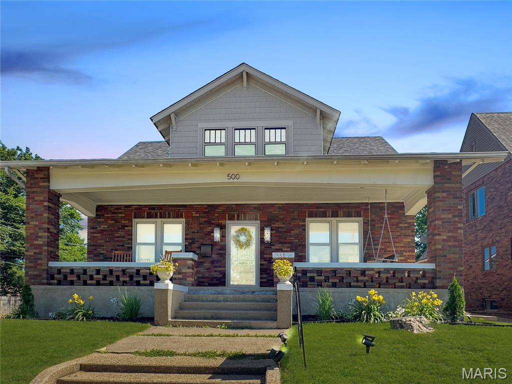Remarkable 1 1/2 story that has been updated and is ready for you to enjoy. Convenient to park, fair, school, public pool, and downtown.  The main level features a living room with wood floors and an abundance of natural light, a Dining room, a kitchen with updates and stainless steel appliances, two bedrooms, and a hall bath. The upstairs level consists of three bedrooms and a full bath. LL is Laundry and storage. Nice front porch and enclosed back porch.  Nice yard with alley behind and large 2-car detached garage. This property is move-in ready. Come See!