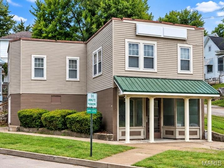Great opportunity offering both commercial and residential space in one property! The main level features approximately 904 sq. ft. of  commercial space with a storefront, two private offices, two entrances, and a half bath. Previously used as an insurance office, the space is well suited for a professional office, small business, or a variety of other uses. Recent updates include new flooring and fresh paint. Upstairs is a neat and clean 2-bedroom apartment, offering the option to operate your business downstairs and live upstairs—or use the apartment for additional income. A screened porch provides entry into the apartment and leads to a spacious living room with crown molding, carpet, and a large walk-in coat closet. The eat-in kitchen includes appliances and a washer hookup. The larger bedroom offers two closets, and the bath features a classic clawfoot tub with shower and a linen closet. A separate storage room is located along the side of the building. Whether you're looking for business space, living quarters, investment potential, or a combination of all three, this property offers plenty of possibilities. #lovewhereyoulive