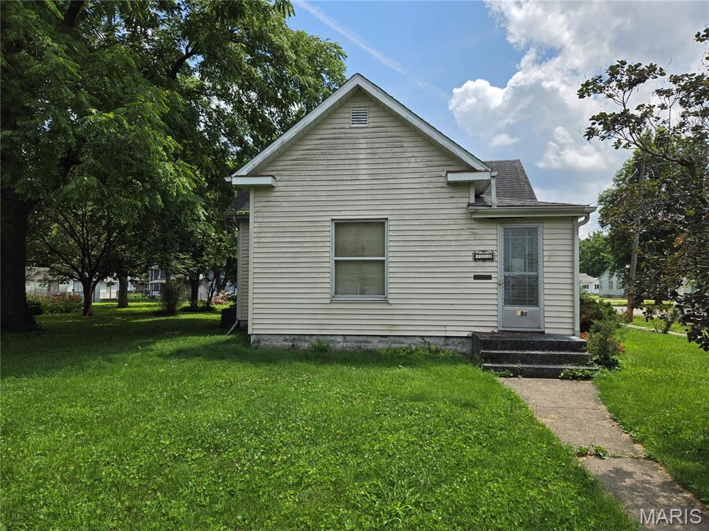 Fixer-upper in Staunton on a large shaded corner lot, close to Fireman's Park. 2 bed, 1 bath, 1,098 sq ft. Living room, kitchen, main-floor laundry, and a mudroom/enclosed porch. Both bedrooms and the bath are on the main floor. Partial basement and crawl space. Detached 2-car garage out back. It needs work, but the lot and location are hard to beat.