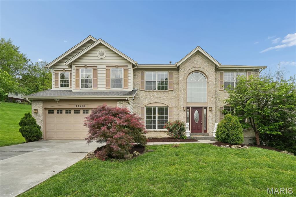 Nestled in the heart of it all—yet offering exceptional privacy—this elegantly maintained and thoughtfully updated two-story residence sits on a premier cul-de-sac lot backing to a serene neighborhood lake, with no adjoining home on one side. Expansive HOA common ground enhances both privacy and the picturesque setting.  Offering approximately 3,934 square feet of refined living space across three levels, the home features a recently renovated kitchen (2022) appointed with a premium granite center island, backsplash, breakfast bar, and KitchenAid Pro-line built-in stainless steel appliances, all complemented by rich wood flooring. The kitchen opens seamlessly to a sunlit breakfast room with a planning desk.
The dramatic two-story great room showcases an impressive wall of windows, flooding the space with natural light and offering scenic views of the pond. The vaulted primary bath features a double vanity, marble tile flooring, a soaking tub, and a separate shower.  Notable April 2026 updates include new carpeting on the main and upper levels, a low-maintenance Trex deck, a resurfaced patio, and a new front door.  Additional features include main-floor laundry, iron baluster railings, two water heaters, an attic fan, and a sprinkler system. The finished lower level offers a recreation room, playroom, exercise room, full bath with shower, and additional storage with built-in shelving.  A one-year home protection plan is included for the buyer. Ideally located near highways, hospitals, shopping, and dining, this home offers a rare combination of setting, quality, and comfort.
