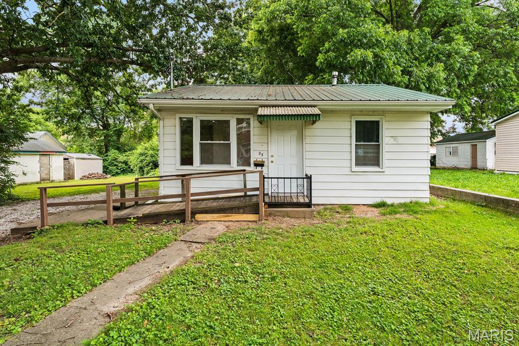 Charming and move-in ready 2-bedroom, 1-bath ranch home featuring newer laminate flooring and carpeting throughout. This home offers comfortable single-level living with a full basement providing plenty of storage space. Enjoy the large backyard, perfect for entertaining, gardening, or relaxing outdoors. City compliant and ready for immediate occupancy, this home is an excellent opportunity for first-time buyers, downsizers, or investors. Don't miss your chance to own this affordable, turnkey home!