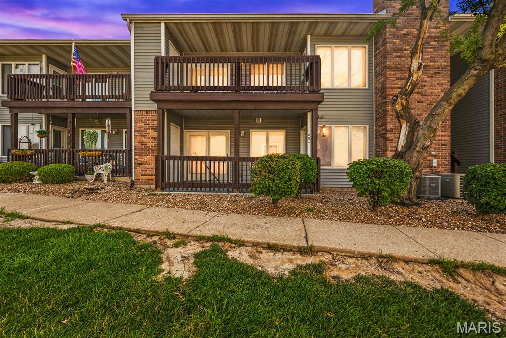 Pool views, a private covered deck, and low-maintenance living - this move-in ready, upper-level condo checks all the boxes! Nestled in the desirable Forest Hills community, this well-maintained upper-level 2-bedroom, 1-bath condo offers a bright, open floor plan with vaulted ceilings, a skylight, and an inviting wood-burning fireplace in the great room. Fresh paint throughout, freshly painted kitchen and bathroom cabinets, and brand-new carpet in both bedrooms make this home truly move-in ready. The kitchen opens to a cozy dining area featuring a built-in planning desk that can easily serve as a home office nook or stylish coffee bar. The spacious primary bedroom includes double closets with a custom organizational system and private access to the covered deck with a convenient storage closet. In-unit laundry and a detached garage provide added convenience and valuable extra storage. Ideally located with easy access to Highways 70 and 94, you'll be just minutes from shopping, restaurants, Lindenwood University and Historic St. Charles. Whether you're a first-time buyer, downsizing, or looking for low-maintenance living in a fantastic location, this condo offers comfort, convenience, and exceptional value.