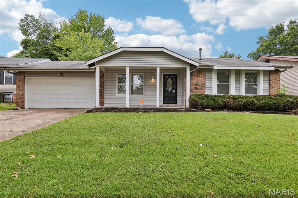 Updated 3-bedroom, 2-bath brick ranch in Pennyrich Farms, Florissant, MO with 1,167 sq ft on the main level plus a finished lower level for approx. 2,000 sq ft of living space. Built in 1977 and refreshed in 2026, the home features fresh paint, luxury vinyl plank flooring, an updated kitchen, and two updated bathrooms. The kitchen features dark cabinetry and opens to a family room with a floor-to-ceiling stone fireplace, ceiling fan, and sliding glass doors to the backyard. A separate living room and front foyer provide a second gathering space. The primary bedroom includes a private full bath; two additional bedrooms share an updated hall bath with tile tub surround. The finished lower level (approx. 833 sq ft, 8-ft pour) works as a rec room, home office, or media area, with laundry and a separate utility and storage area. Outside: covered rear patio, fenced backyard, storage shed, and attached 2-car garage. Systems include central air, forced-air natural gas heat, attic fan, and updated plumbing. Hazelwood School District (Townsend Elementary, Central Middle, Hazelwood East High). Pennyrich Farms is an owner-occupant subdivision. HOA $150/year. Approx. 2.8 mi to Schnucks, 3 mi to Aldi, and 3.5 mi to Spanish Lake Park. 3D walkthrough available.