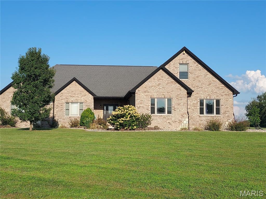 If you've ever dreamed about having a little more elbow room, your own pond, plenty of space for everyone to spread out, and a home that can handle everything from quiet Saturday mornings to a house full of friends and family, you might want to see this one.
Set on just over 5 acres in the Fenton Farms subdivision, this nearly 5,000-square-foot home has the kind of space that makes you wonder where you've been putting all your stuff. With 5 bedrooms, 4 full baths, multiple living areas, and a finished lower level, there’s room for the kids, the guests, the hobbies, the home office, the workout equipment…and all of the stuff  you've been saying you'll organize someday.
The heart of the home is the kitchen, where everyone always ends up eventually. A big center island, loads of cabinetry, breakfast area, and an adjoining family room with a wood-burning fireplace make this the perfect spot for morning coffee, holiday chaos, or just having a few people over.
The main-level primary suite gives you a little escape from all that activity, with a sitting area, walk-in closet, and a spacious bath featuring dual sinks, soaking tub, and tiled shower. Two additional bedrooms share a convenient Jack-and-Jill bath, and the main-level laundry keeps life a little more civilized.
Then there's upstairs. The bonus room is open to possibilities. 5th bedroom? Game room? Home office? Hobby headquarters? With it’s own HVAC, it can be whatever your family needs at the time and change down the road without impacting the rest of the home.
And just when you think you've run out of house, head downstairs. The finished lower level brings even more living and entertaining space, additional bedroom, exercise room, storage, and a safe-room area. 
Outside you’ve got room to roam or get those chickens you’ve always wanted on the 5+ acres with a private 0.92-acre pond. Start imagining yourself sitting outside with a cup of coffee, watching the sunrise over the water, while the rest of the world feels just a little farther away.
There's also an oversized two-car garage, equipment shed, geothermal heating and cooling, and plenty of practical features that make living here as easy as it is enjoyable.
Need even more space? The adjacent 2.16 acre lot is also available for purchase.