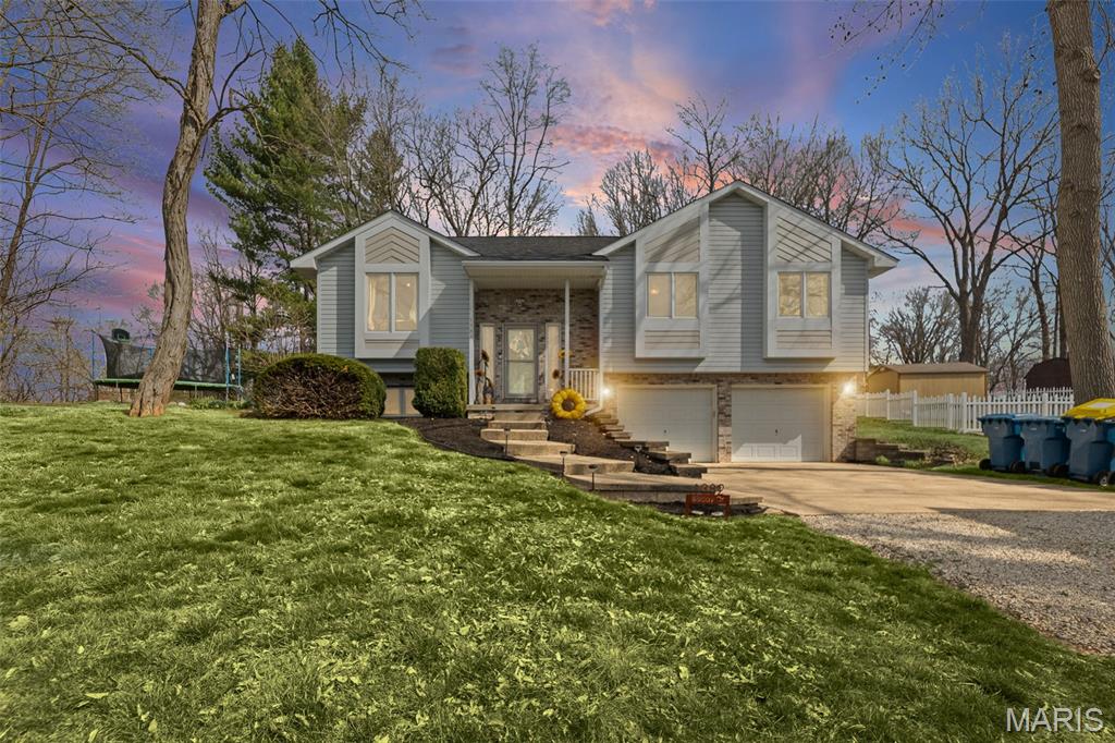 Back on market! Welcome to your next chapter in the highly sought-after Holiday Shores community—where space, style, and a lake lifestyle come together. This impressive 6-bedroom, 3.5-bath home offers the perfect blend of function and luxury, all located in the desirable Edwardsville School District. Whether you need room to grow, entertain, or simply spread out, this home checks every box. Step inside and you’ll immediately notice the attention to detail in the heart of the home—the kitchen. Featuring stunning quartz countertops with a unique live edge finish, an induction cooktop, convenient pot filler, and high-end appliances, this space was designed for both everyday living and entertaining. And yes… all appliances stay, including the washer, dryer, ice maker, and wine chiller—making this truly move-in ready. The spacious layout offers six true bedrooms, giving you flexibility for guests, home office space, or multi-generational living. With 3.5 bathrooms, mornings just got a whole lot easier. The inviting living area features a cozy fireplace—perfect for those Midwest evenings—while the sun room provides a bright, relaxing space to enjoy your morning coffee or unwind while taking in the surrounding views. Head outside and enjoy your own private retreat. The fenced backyard is perfect for kids, pets, or simply relaxing. Picture evenings around the fire table or unwinding in the hot tub after a long day. Need storage? The extra-deep garage provides plenty of room for vehicles, tools, toys, or that “I’ll get to it someday” project. Located in the Holiday Shores subdivision, you’ll enjoy not just a home—but a lifestyle. From lake access to a welcoming community, this is where memories are made. If you’ve been waiting for a home that has the space, upgrades, and setting to truly stand out… this is it. This home is sold as-is.