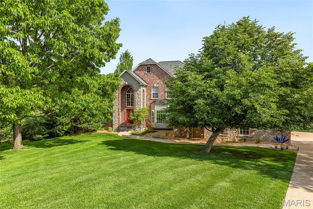 Stunning 1.5 story home sitting on 3 acres located in the sought after gated, golf course community of Paradise Valley! This home boasts 4 bedrooms, 5 bathrooms, and 6,000+/- square feet of living space.

The front door opens to the 2 story entry foyer with a coat closet, tinted window, and hardwood floors that were resurfaced in 2023 and flow throughout most of the main level. The entry foyer opens to the formal dining room with a bay window and the den with new carpeting (2023) and a tinted window. The two story great room features a gas fireplace and 4 pillars.

The kitchen boasts quartz countertops, maple 42 inch cabinetry with crown molding, tile backsplash, center island with a gas cooktop, GE Profile stainless steel appliances, warming tray, bar area, dining area with bay windows, a walk-in pantry, and opens to the hearth room with a wood burning fireplace and wall of windows.

The primary bedroom features his and hers closets and a luxurious, updated bathroom (2023) with an Onyx shower, tub, Onyx countertops, water closet, and linen closet. The laundry room with a utility sink and the powder room complete the main level.

The second floor features 3 bedrooms with new carpeting (2023), which all feature walk-in closets. One has a private full bathroom and the other two are connected by a Jack and Jill bathroom.

The finished, walkout lower level boasts a huge recreation room with a wet bar, home theatre which is wired for surround sound and has floor lighting, a bathroom, and ample storage space.

Other highlights include: triple zoned HVAC, new main level HVAC (2021), new lower level HVAC (2022), and new 2nd floor AC (2019), water softener, wrought iron spindles, arched 2 panel doors throughout, most of the home was repainted (2023), new flooring in lower level (2023), side entry 3 car garage which is insulated, new garage doors (2022), new garage door opener (2022), new roof with architectural shingles (2020), two new 50 gallon hot water heaters (2018), washer and dryer are included, and engineered floor joists throughout to prevent squeaking floors, and floor joists are spaced at 8" above primary bedroom for quiet floors.

Relax outside on the Trex deck with vinyl railing or on the huge aggregate patio with a fire pit area, and enjoy the private backyard with a pond. The pond has goldfish and attracts all kinds of wildlife including herons, ducks, turtles, geese, frogs, deer, and owls.

Enjoy resort style living in the Paradise Valley Golf Course community, where beautifully maintained grounds, a championship golf course, clubhouse, dining, and breathtaking views create a lifestyle that's hard to match.

Location could not be better – close to major highways, restaurants, shops, schools, and the Paradise Valley golf clubhouse! Part of the award winning Rockwood school district!