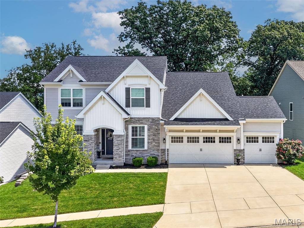 Set in one of Chesterfield’s most convenient locations with quick access to Highway 40/64, this stylish 5-year-old 1.5-story delivers a strong mix of space, function, and comfort. The main level includes a formal dining room, private office, and a crisp white kitchen with quartz countertops, oversized island, and walk-in pantry. The kitchen flows into a spacious great room with fireplace, while the primary suite is privately tucked on the main floor. The covered back porch is unbeatable, complete with a wood-burning fireplace and peaceful wooded views, it’s perfect for quiet mornings, evenings outside, or fall game days with family and friends. A new deck extends the outdoor living space even further. Upstairs offers three generous sized bedrooms, including a Jack-and-Jill setup and a private en suite. The finished lower level is made for entertaining with a full bar, TV room, playroom, private bedroom, and large full bath. Additional highlights include an extended three plus-car garage, zoned HVAC, and the most convenient location. Easy Walk and accessibility to downtown Chesterfield when completed