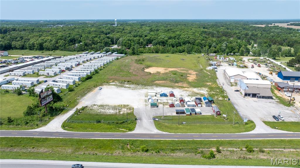 Opportunity is Knocking!! Hwy 70 Front Commercial/Industrial Property+ Access to All Utilities=  Endless Possibilities.  Very Few Properties in the area like this one. Nice Visibility to the Highway.  Perfect for all businesses!!!