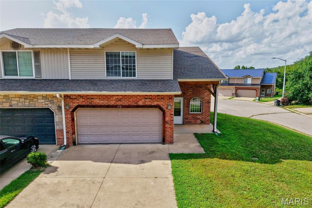 Well-maintained 3 bedroom, 2.5 bathroom half duplex offering a spacious two-story layout and an attached 2-car garage. Step inside to a tile entry foyer and a welcoming living room with carpet flooring that flows seamlessly into the kitchen, creating an open and functional living space. The tiled kitchen features ample cabinet and counter space, along with a breakfast bar overlooking the living room, making it easy to stay connected while preparing meals or entertaining guests. A convenient half bathroom and direct access to the attached garage complete the main level.

Upstairs, all three bedrooms are thoughtfully situated for privacy, including the owner's suite with its own private bathroom. Two additional bedrooms, a second full bathroom, and a laundry room conveniently located on the same level provide a practical floor plan designed for everyday living.

The property is positioned facing the street, while the lot extends alongside a cul-de-sac, providing additional outdoor space and a unique lot layout. Conveniently located just minutes from Interstate 44, the main gate of Fort Leonard Wood, shopping, restaurants, schools, and other St. Robert amenities, this home offers easy access to everything the area has to offer. Whether you're looking for a primary residence or an investment opportunity, this low-maintenance property is one you won't want to miss. Schedule your private showing today!