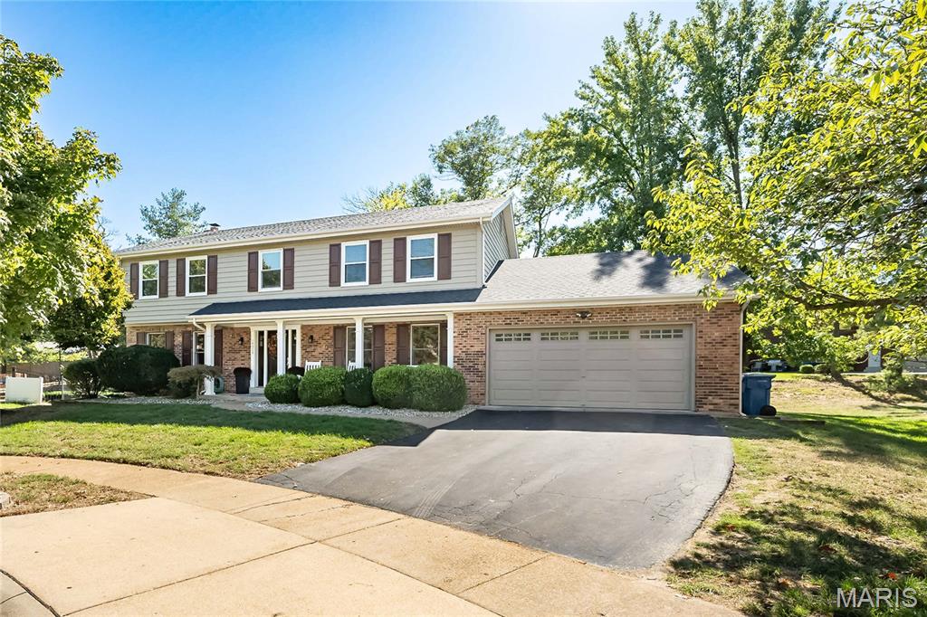 This beautifully updated 5-bedroom, 3.5-bath home sits on a private street and cul-de-sac and is truly move-in ready. It offers an open floor plan with fresh paint and wood floors throughout and one of the largest lots in the neighborhood. The kitchen is stunning and offers an eat-in kitchen with an oversized marble island, stainless steel appliances, 42" cabinetry, double oven, a task desk and an oversized walk-in pantry.  The adjoining dining room located just off of the kitchen is ideally located and provides plenty of space to enjoy large family meals. The living room and family room offer ample space to relax and entertain.  In addition, the main-floor also offers an oversized laundry and mud room with built-ins, a charming screened-in porch and an additional 1/2 bath.  Upstairs features five large bedrooms with walk-in closets and two full baths, while the finished lower level provides even more flexible living space, storage and an additional full bathroom. Set on a desirable half-acre lot with beautiful curb appeal in a sought-after subdivision within the Parkway Central school district—and less than a mile from major highways, restaurants, and shopping—this home combines space, style, convenience, and an exceptional location, making it a rare find that truly has it all.