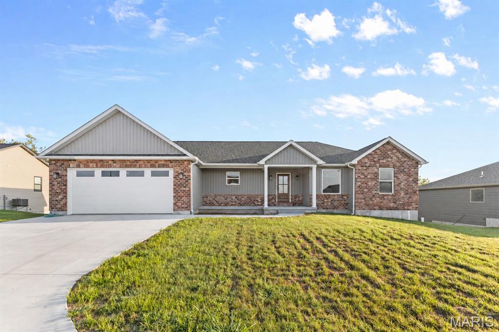 Welcome to Martin Creek, a newly developed subdivision just outside the city limits and less than 10 minutes from downtown Farmington. This beautifully designed 3-bedroom, 2-bath home offers 1,796 sq. ft. of thoughtfully planned living space with an upscale feel throughout. The split-bedroom floor plan provides privacy and functionality, while the spacious primary suite offers a convenient layout with direct flow from the bedroom into the bathroom, large soaking tub, walk-in closet, and laundry room. The open-concept living spaces are complemented by quality finishes and elevated details throughout the home. Enjoy additional living and entertaining space on the spacious covered deck overlooking the surrounding landscape. The unfinished walkout basement provides excellent potential for future living space, a recreation area, or storage. An oversized 2-car garage adds plenty of room for vehicles, equipment, and everyday needs. With its combination of style, functionality, and peaceful setting, this Martin Creek home offers comfortable modern living just minutes from everything Farmington has to offer.