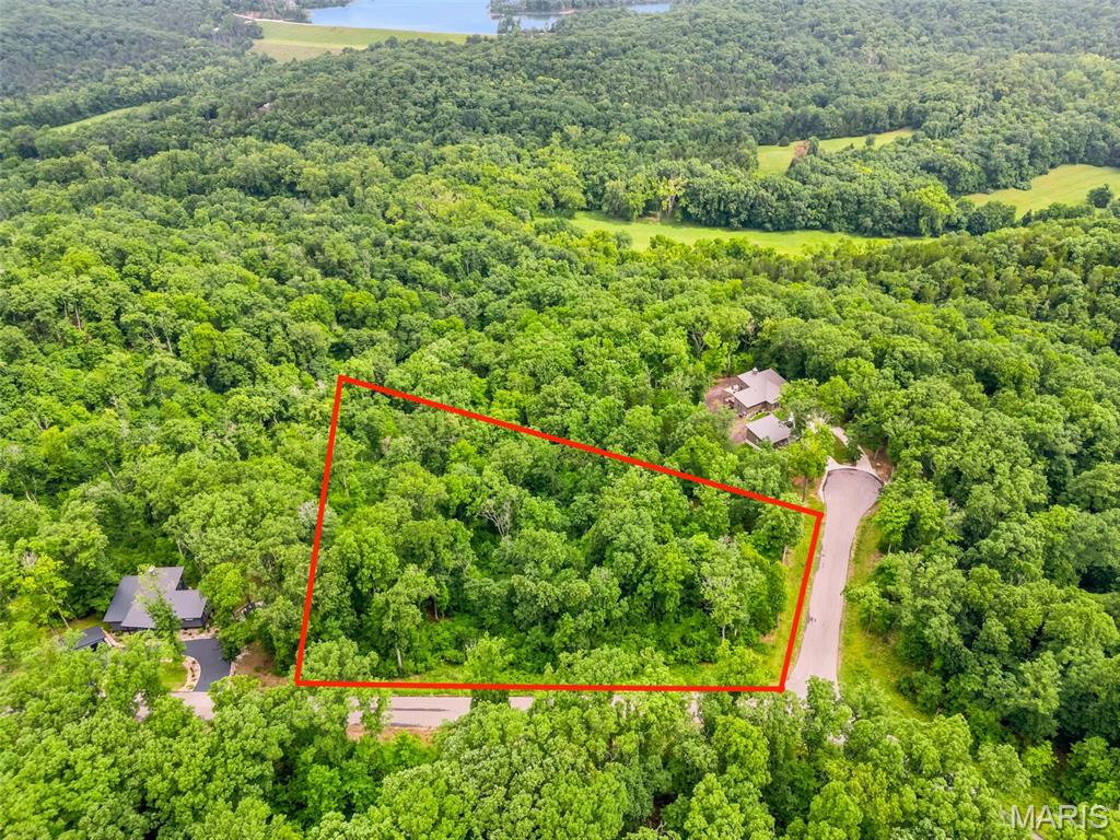 Create your own custom treehouse escape on this picturesque 2.04-acre lot with a possible view of Alpine Lake, nestled among mature hardwoods and serene wooded surroundings. Perched above the forest floor, this homesite offers stunning natural scenery and an ideal setting for an Innsbrook Signature Treehouse concept, your own thoughtfully designed private retreat immersed in nature.
Situated in the highly sought-after Tyrolean region of Innsbrook, this gated enclave features its own private entrance and a peaceful, secluded atmosphere. Enjoy convenient access to multiple lakes, the Tyrolean nature trail, and nearby Charrette Creek Commons, offering an outdoor pool, restaurant, fitness center, outdoor amphitheater, playground, and pickleball courts.
Whether you’re planning a full-time residence or a relaxing weekend getaway, this private wooded property delivers the perfect blend of tranquility, recreation, and opportunity.
