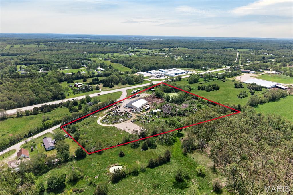 Exceptional investment and business opportunity on 9 acres in the county! This versatile property features an impressive 11,000 sq. ft. main building along with two additional buildings, offering endless possibilities for warehousing, manufacturing, retail, office space, storage, or a multi-tenant business venture. The property has recently been transformed into a thriving antique mall with booth rentals and currently maintains a waiting list of vendors seeking space. The seller is actively expanding and improving the building to accommodate additional booths and create even greater income potential. As renovations are completed, booth rental income increases, and new opportunities are added, the asking price will continue to rise. With over 12,500 square feet of usable building space and room for future growth, this property offers an excellent combination of current income and long-term upside. Whether you're an investor, entrepreneur, or business owner looking to expand, this is a rare opportunity you won't want to miss. Schedule your private showing today!