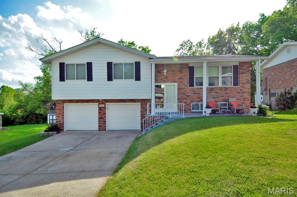 3 bedroom, 2.5 bathroom updated split level home conveniently located in Arnold, Jefferson County. Main level offers nice size living room, dining room, newer kitchen with white kitchen cabinets, granite countertops, stainless steel appliances and mosaic tile backsplash. Master bedroom with  updated full bathroom with ceramic tile flooring and shower enclosure. Updated main level bathroom and 2 more bedrooms complete main level. Finished walkout lower level offers large rec room, newer half bathroom, laundry room and access to 12x20 covered concrete patio, perfect for your outdoor entertainment. Mostly leveled backyard, enclosed/screened garden and storage shed. Two car oversized garage. Updated electric, wood floors in living room, dining room and all bedrooms, new roof 2023. Close to shopping and area restaurant, easy access to highway 141 and 55.