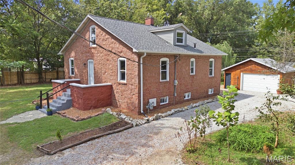 Looking for a cottage-style home on over half an acre with privacy and homesteading potential? This could be the one! The expansive property is fully fenced and features a powered entry gate, providing plenty of space to garden, entertain, play, and enjoy the outdoors. Established fruit-bearing trees, fruiting vines, raised garden beds, composting areas, and large patios create an ideal setting for a self-sufficient lifestyle. A former well also remains on the property and may provide an additional option for outdoor watering.

The manageable home allows you to spend less time on upkeep and more time enjoying the property. Inside, you’ll find three bedrooms, two full bathrooms, and plenty of additional space in the basement. A wood-burning stove was added to the basement in 2023, creating a warm and inviting space with flexible possibilities.

Numerous improvements have already been completed, including a new HVAC system in 2023, roof and electrical breaker panel in 2024, and an updated tankless water heater. The kitchen was refreshed in 2026 with new cabinets and countertops, while all kitchen appliances have been replaced within the past five years. Additional 2026 updates include a smart toilet, vanity, and mirror in the main-floor bathroom; a new vanity and mirror in the upper-level bathroom; a new front door; and refreshed front landscaping.

With its cottage charm, generous grounds, established gardens, and extensive improvements, 1705 Centreville Avenue offers a rare opportunity to enjoy space, flexibility, and homesteader-inspired living. All information is deemed reliable but not guaranteed; buyer and buyer’s agent to verify.