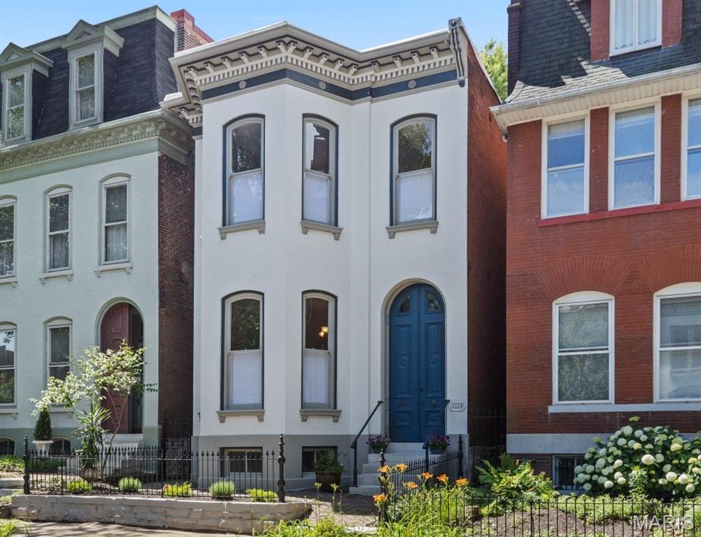 On a secluded tucked away oasis a half block off Lafayette park sits the renewed and beautiful 2024 Rutger. This brick house is packed with 2026 updates while restoring and enhancing the unbeatable craftsmanship of a classic Victorian star. Behind the iron fence, through the transom doors a foyer greets you to sit and enjoy the living room with gorgeous bay windows, marble fireplace, crown molding and period lighting. Dining room is amazing for entertaining with new hardwood floors that continue through the hall and kitchen. Live and love life in this light bright new and fabulous chefs kitchen. Commercial-grade, gas range, stainless refrigerator, new wine refrigerator, breakfast bar, new thermal windows, and quartz counters with full height backsplash. The essential 1st floor half bath! New deck and old brick patio share the lush green private yard with an amazing oversized two car garage. Upstairs you will be delighted with an incredible primary suite. Timeless updated hall bath. Two additional bedrooms and a laundry room. The lower level is an additional 1000 sq ft of extra flex space - great for workshop, storage, art, exercise! It is hard to find a more desirable nook in Lafayette Square, walk down the brick sidewalks and stare up at the canopy of the old growth trees and you will know this is where you want to be. Welcome to the neighborhood we look forward to meeting you.